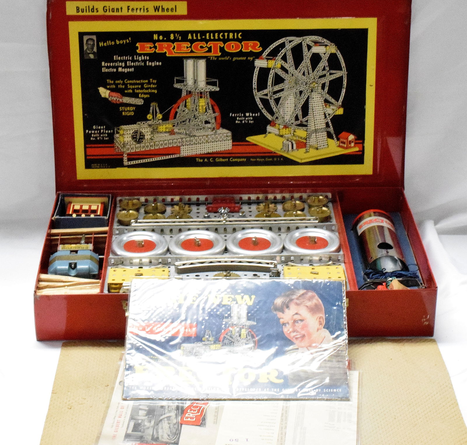 ERECTOR SET #8 1/2 ALL-ELECTRIC: Complete all-electric erector set #8 1/2, made by the The A.C Gilbert Company in 1950. Red metal box, original paint, reproduction inserts, builds a ferris wheel. Good condition. L: 20 1/4in, W: 12 1/