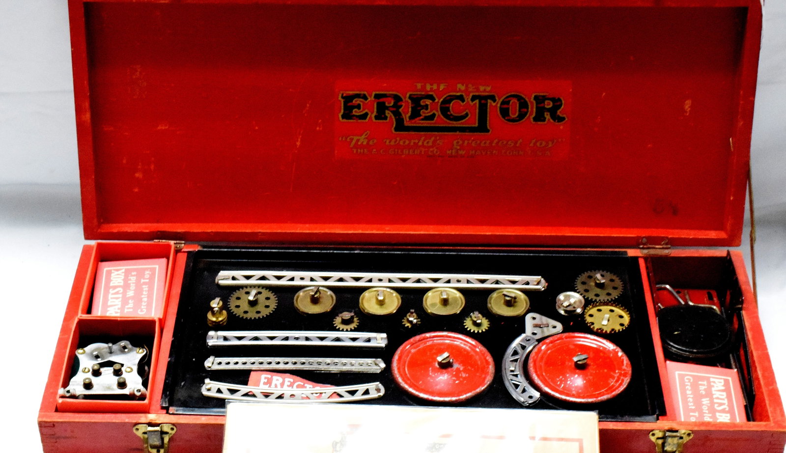 ERECTOR SET #5 1/2: Very rare erector set #5 1/2, made by A.C Gilbert Company in 1933. Reproduction lower panel, red wooden box. Good condition. L: 21 1/2in, W: 8 1/2in, H: 3in, Weight: 7 lbs.