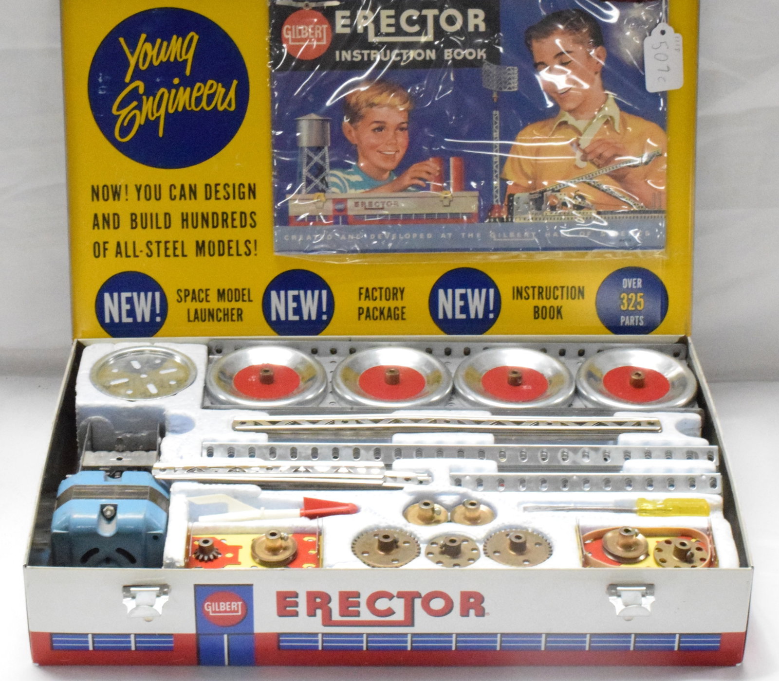 ERECTOR SET #10053 ROCKET LAUNCHER: Complete erector set #10053, rocket launcher set, made by The A.C Gilbert Company in 1961. Metal box with red base and grey cover, styrafoam inserts. Good condition. L: 16 1/2in, W: 10 1/2in, H: 3in,W