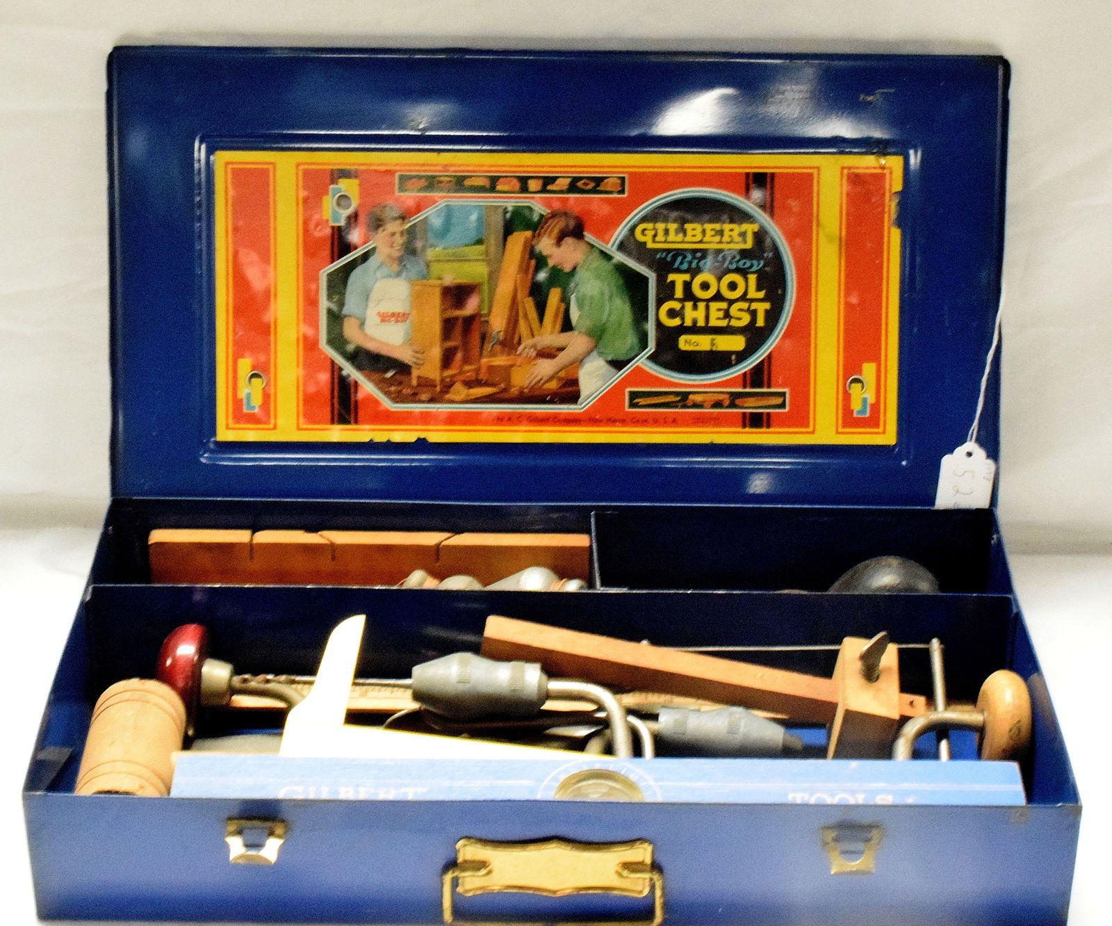 GILBERT TOOL CHEST #5: Blue Gilbert "Big Boy" tool chest #5. Made by A.C Gilbert company. Metal box, comes with various tools. Good condition. L: 18 1/4in, W: 10 1/4in, H: 3in, Weight: 9 lbs.
