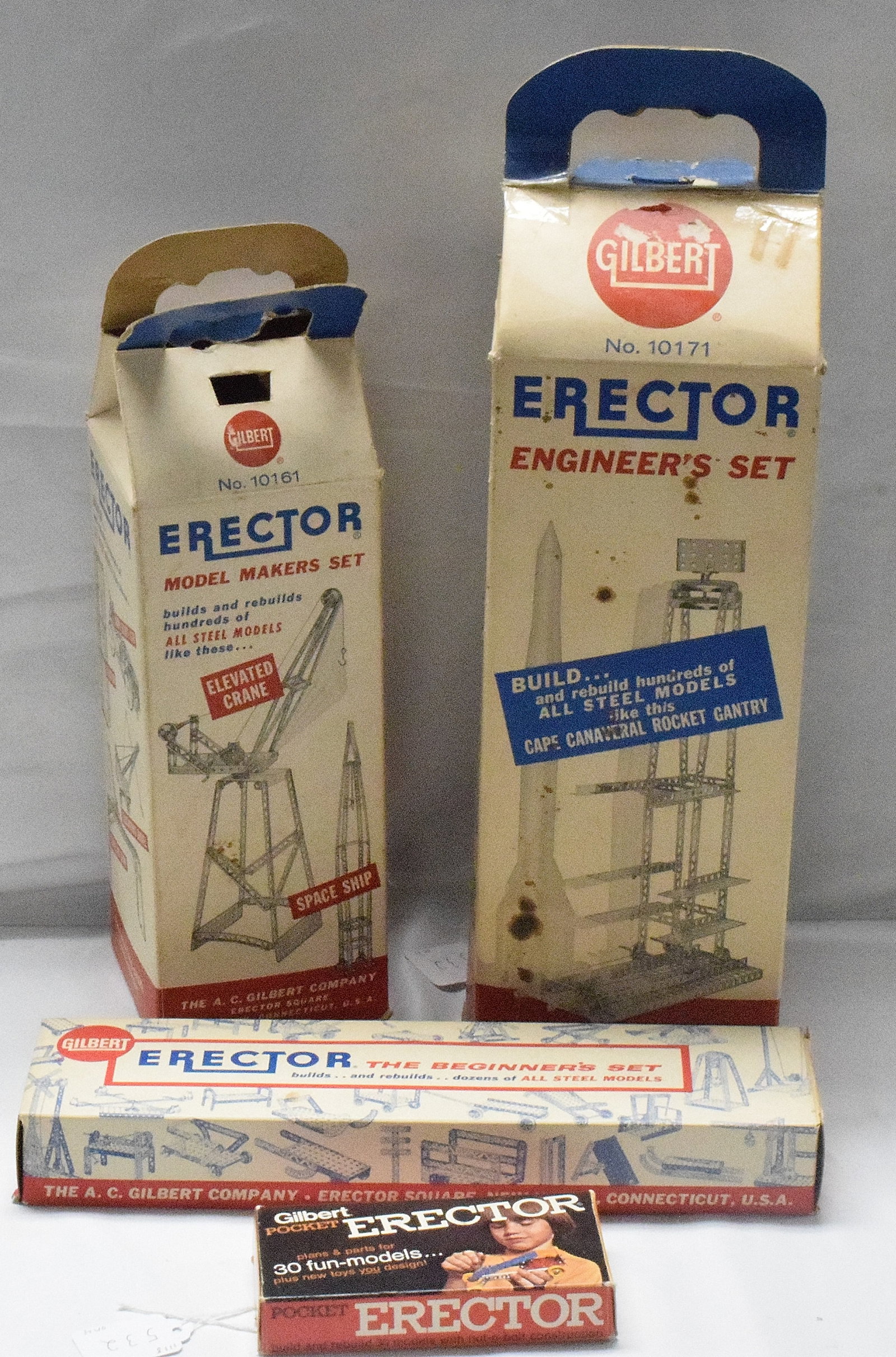 4 ERECTOR SET BOXES: (1) Engineers erector set #10171, white milk carton box. Not complete. (2) Erector set #10161, The model maker set, white milk carton box, complete set. (3) Erector set #10016, Thebeginners set, recta