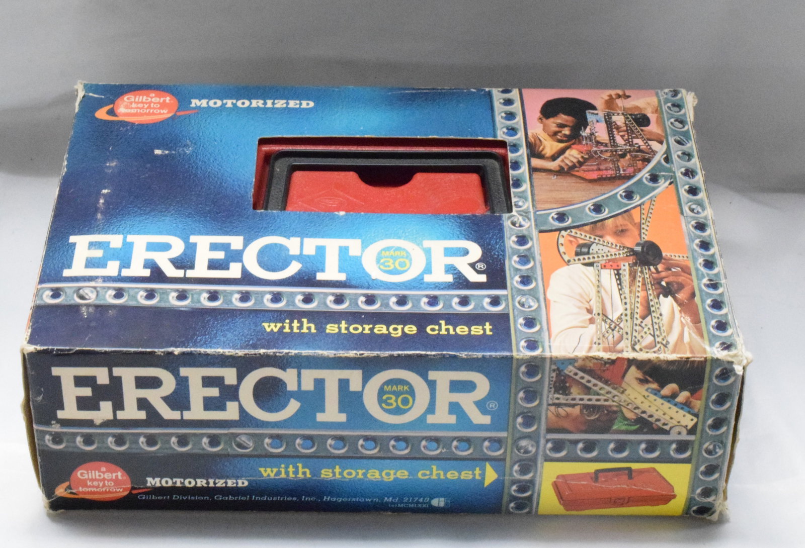 ERECTOR SET #31103 PLASTIC STORAGE CHEST: Erector set #31103, plastic storage chest, blue cardboard box cover and with red storage chest, motorized set. 1960's, made by The A.C Gilbert Company. Good condition. L: 11 1/2in, W: 7 1/2in,H: 3 1/2