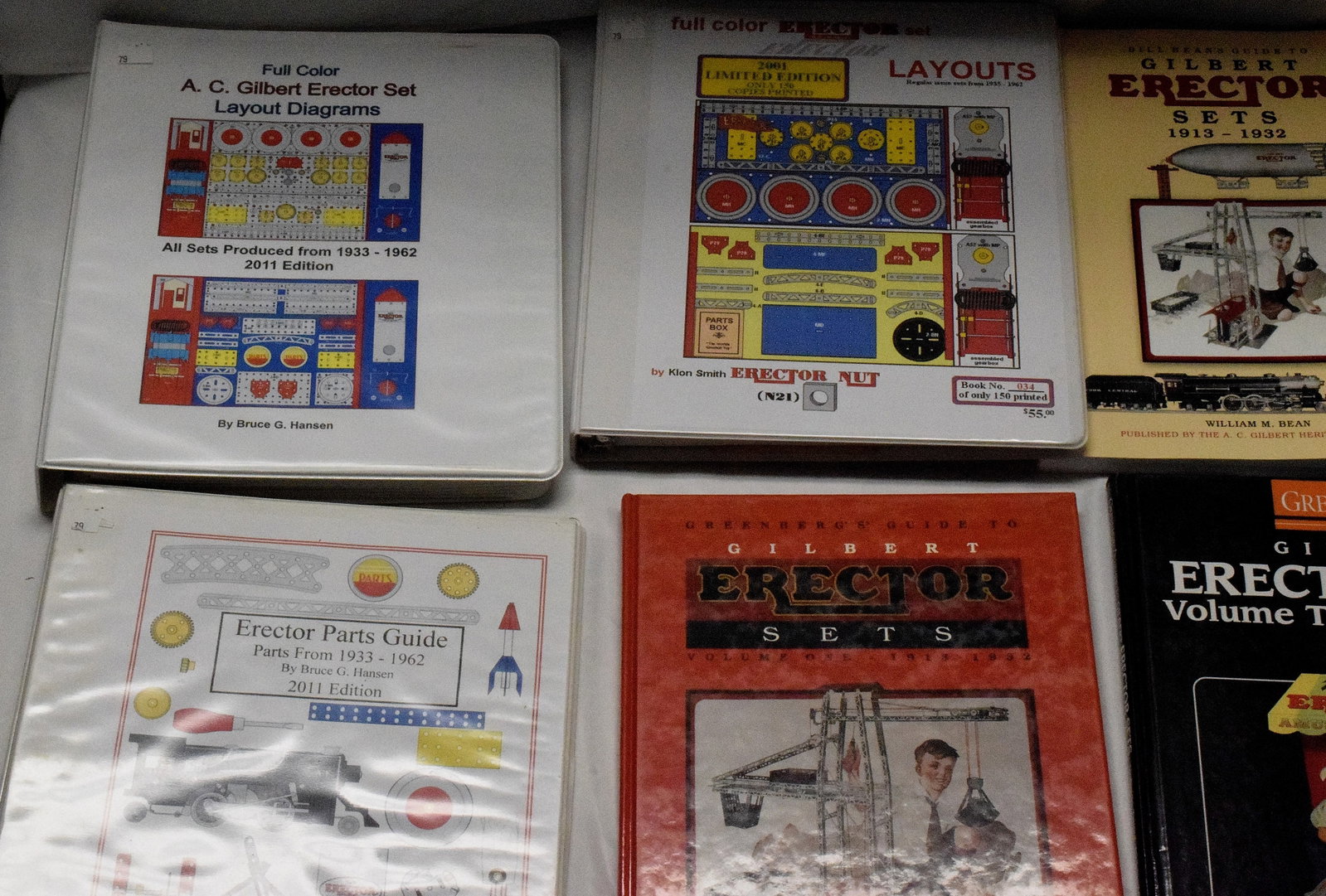 ERECTOR SET BOOKS AND BINDERS: Various binders and books on erector set model displays and the history behind erector sets. Some binders include manuals and instructions for arranging erector sets as well display originalerector se