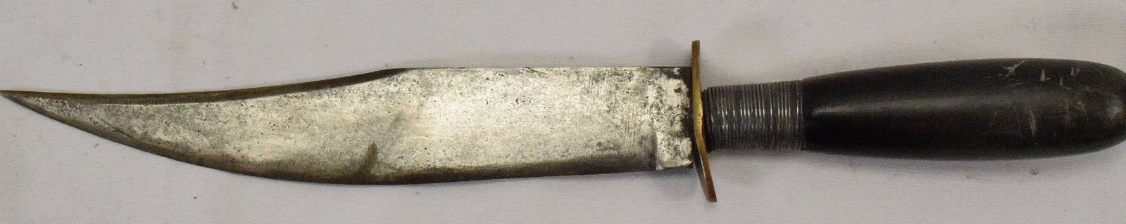 ANTIQUE BOWIE or FIGHTING KNIFE.: Ca 19th century. Wood handle with wire wrapped construction. Metal or silver. Not sure. Small brass guard. 12 inches total length. Blade 7 1/4 inches. Blade was re-sharpen. Shipping weight 2pounds.
