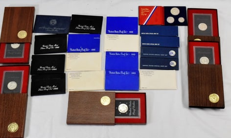 16 US PROOF COIN SETS & 7 EISENHOWER DOLLARS