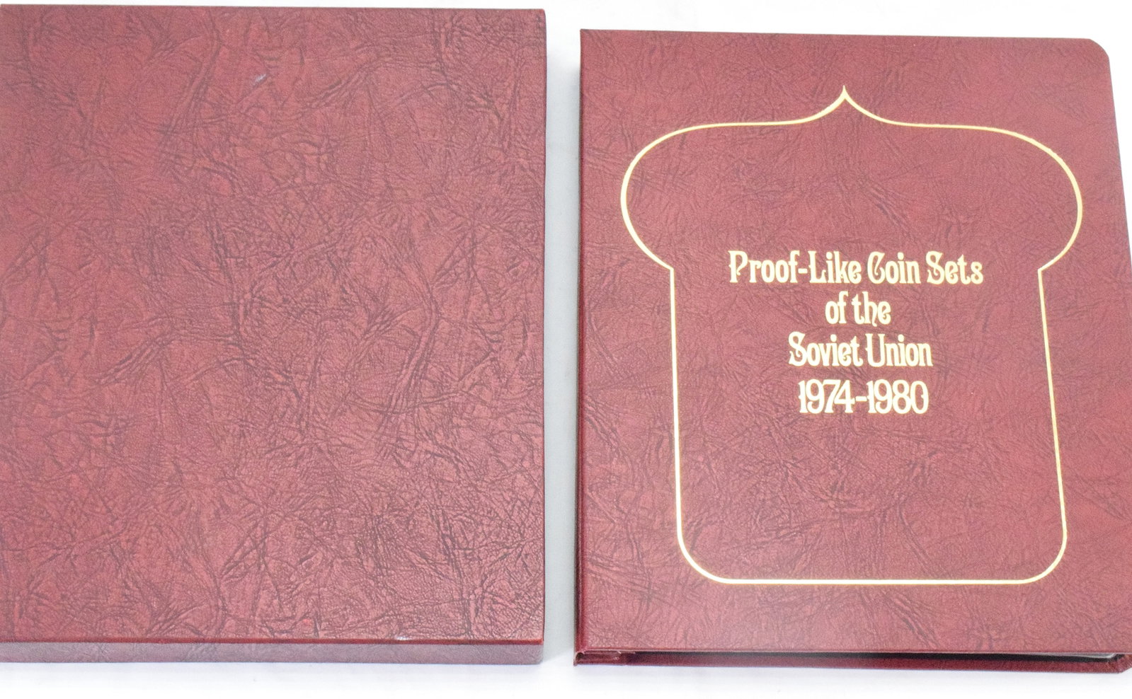 PROOF-LIFE COIN OF SOVIET UNION ALBUM: Collection album and sleeve of Proof-Like coin sets of the Soviet Union 1974-1980. 10 1/2 inches x 12 inches x 2 inches tall. Shipping weight approx. 1 pound.