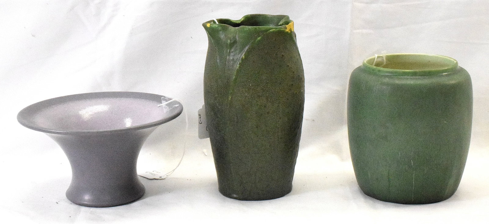 3 ART POTTERY GROUPING WITH DAMAGE: Consists of 1) Matte green glazed signed Grueby Faience Pottery Company Boston vase. Signed with Grueby mark. 7 5/16 inches tall. Tri pinch top. Chips on rim. Does have glazei mperfections in the maki