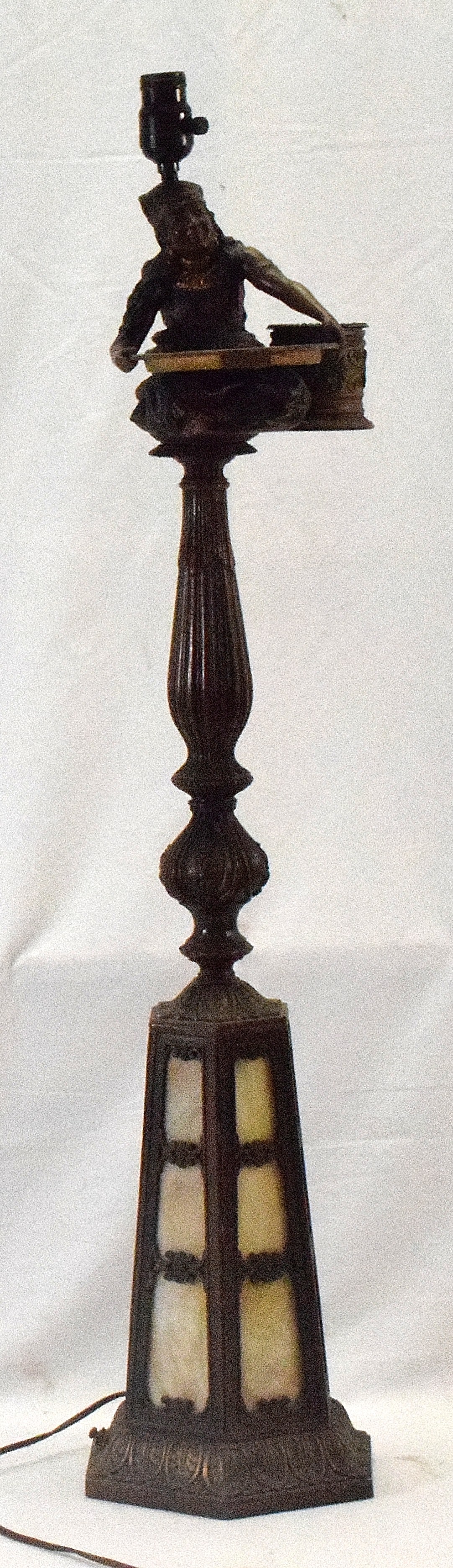 ART NOUVEAU GYPSY FLOOR & ASHTRAY METAL SLAG LAMP: Ca 1910. Metal cold painted white metal patina carmel slag glass lighthouse lamp base with figural gypsy ashtray and match holder. One side on other side of match holder missing. Lightworking. 40 inch