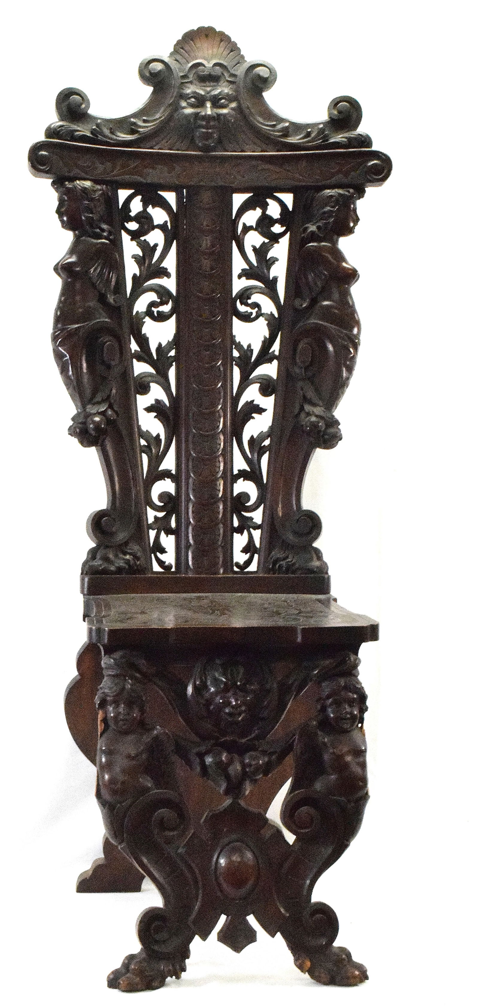 CARVED 19TH FANCY RENAISSANCE REVIVAL CHAIR: Hign back carved very fancy Walnut renaissance revival chair. 64 inches tall x 22 inches wide x 23 inches deep. Damage to bottom front of wings of cherups. As is.