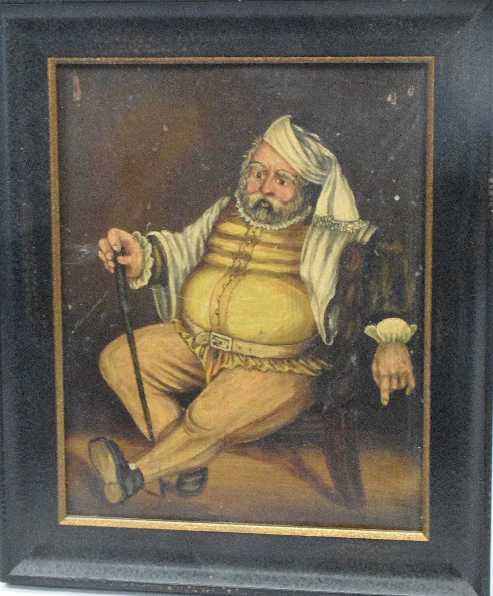 19TH CONTINENTAL SCHOOL CHARACTER PAINTING: 19th unsigned character in the style of "Punch" with associated with the Toby mugs. Oil on panel. A very jovial heavy set man in 18th century attire, night cap, walking stick in a black frame. Image 1