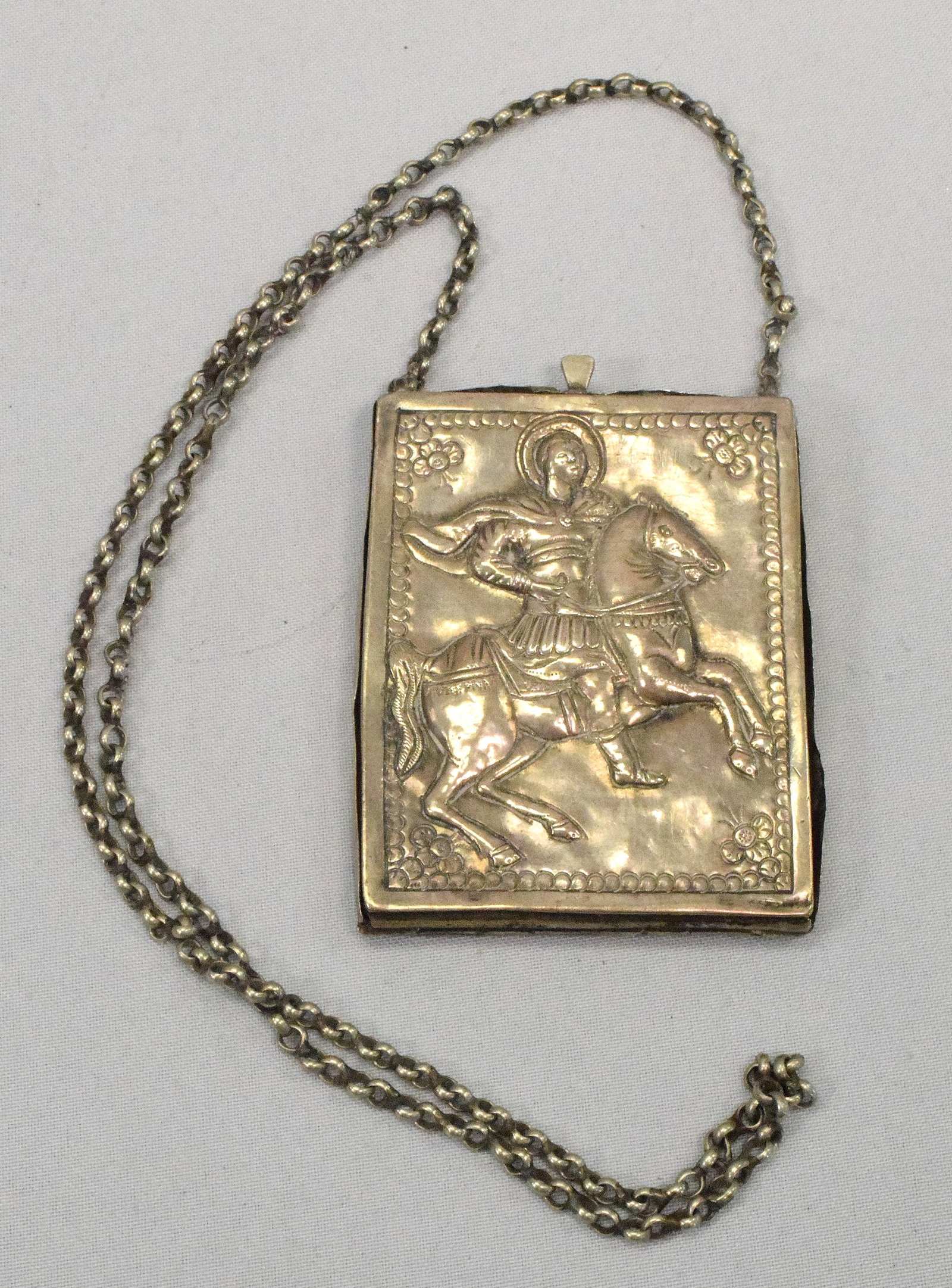 ANTIQUE SILVER GREEK HANGING PENDANT ICON: 18th/19th Antique silver Greek hanging pendant icon. St George case with star David on back. Silver case of low silver grade. Interior with divided greek icon on wood. 3 1/8 x 2 1/2 inches.Wear and lo