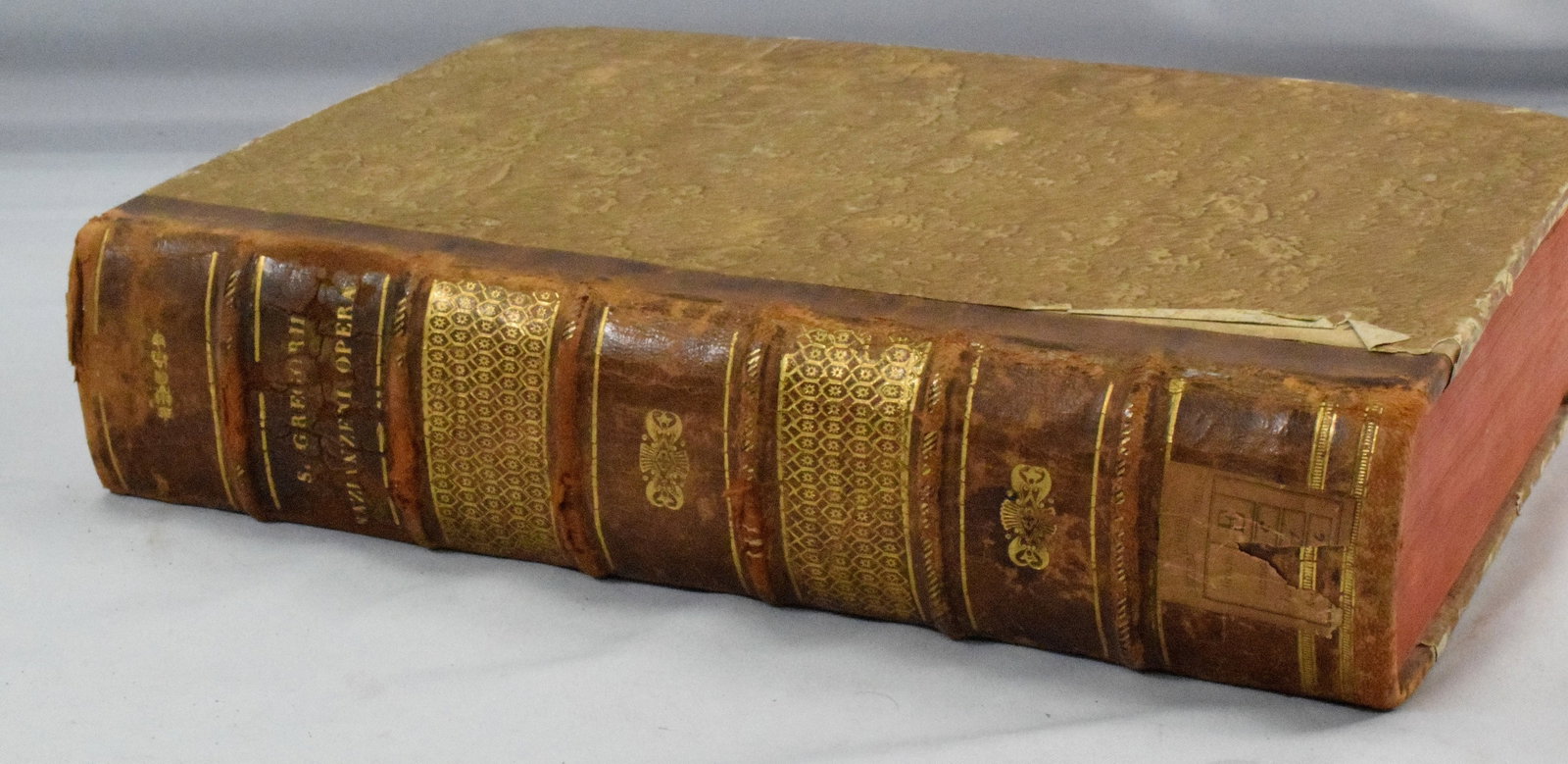 1630 GREGORII NAZIANZENI THEOLOGI OPERA BOOK: Greek book, written in Greek and Latin. This edition printed in Paris 1630 by C. Morellus. 14 inches x 9 1/2 inches x 3 1/2 inches. Some wear. The Estate of Nicholas Mitropoulos 1952-2025.