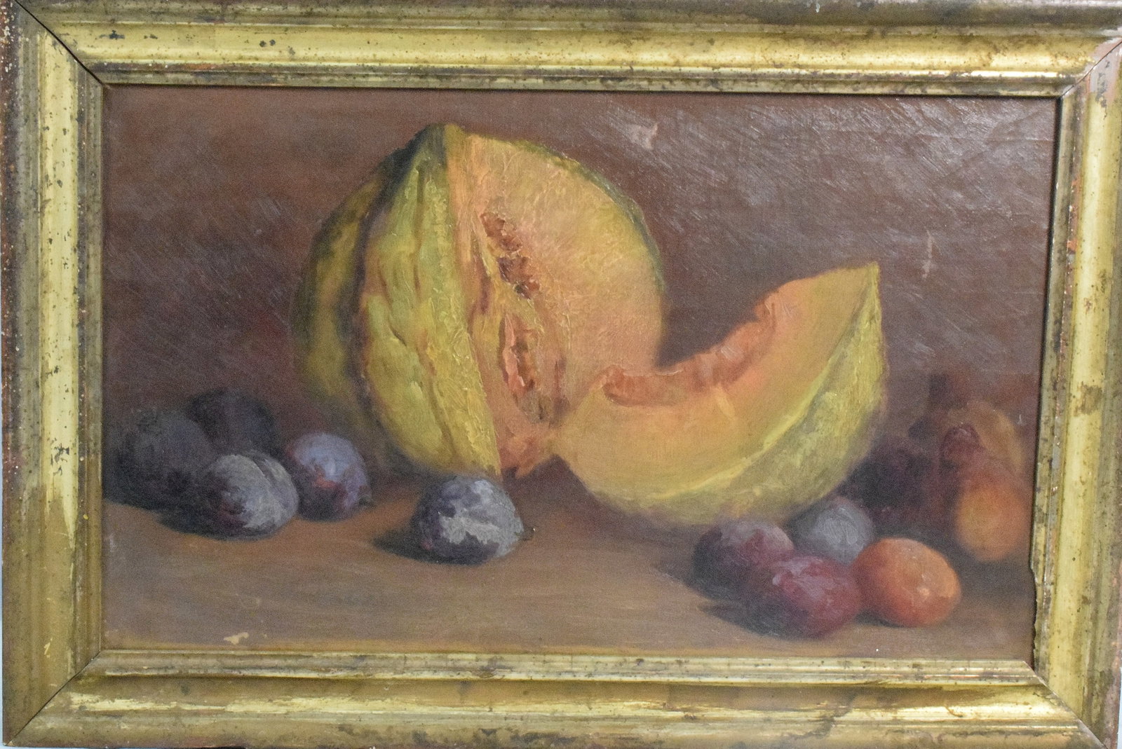 19TH STILL LIFE OIL PAINTING: 19th century Still Life oil painting. Unsigned and artist unknown. Features cantaloupe and other various fruits. Oil on canvas. Image 12 inches x 20 inches. Believe American. Writing on backrefers to