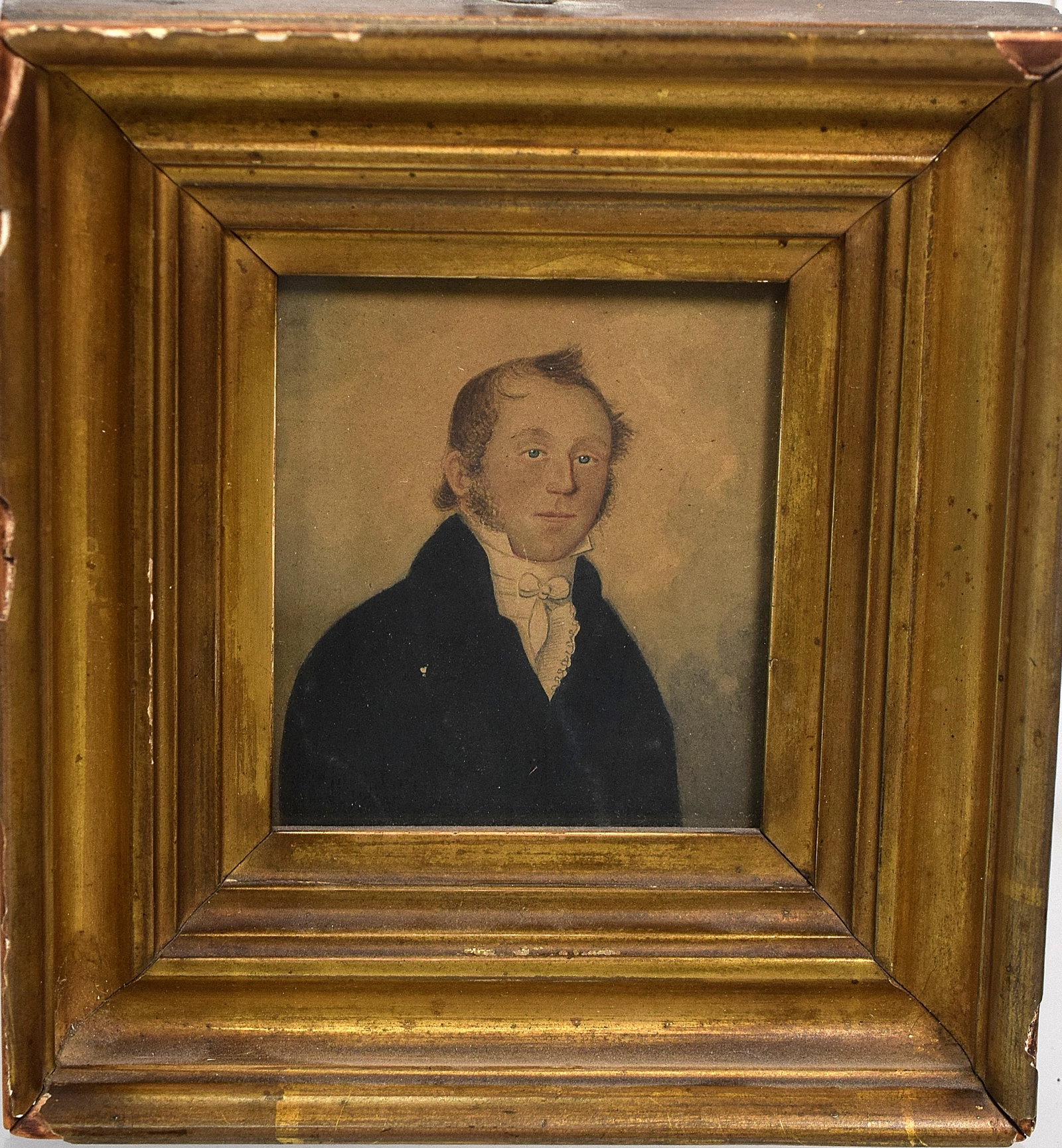 MINIATURE WATERCOLOR PORTRAIT: Ca early 19th century. Likely American. Male figure in dark blue coat. Not signed. Watercolor on paper. Original frame. Image 3 inches x 2 3/4 inches. Frame 5 3/4 inches x 5 1/4 inches.