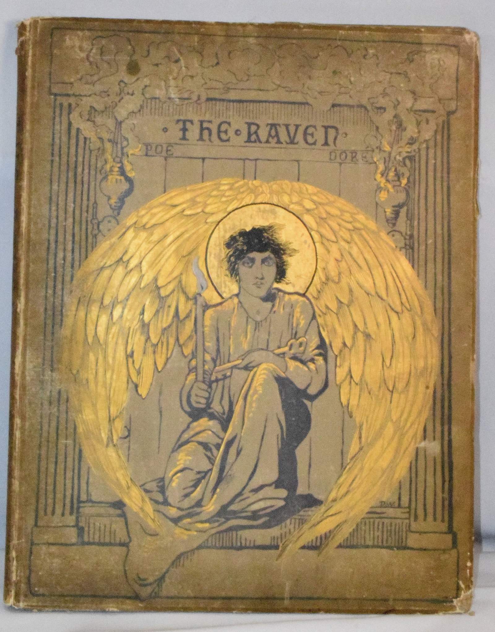 THE RAVEN BOOK 1884 EDGAR ALLEN POE: Large 1884 book. 18 1/2 inches x 15 inches. Illustrated by Gustave Dore. Wear to cover and stains. The Estate of Nicholas Mitropoulos 1952-2025