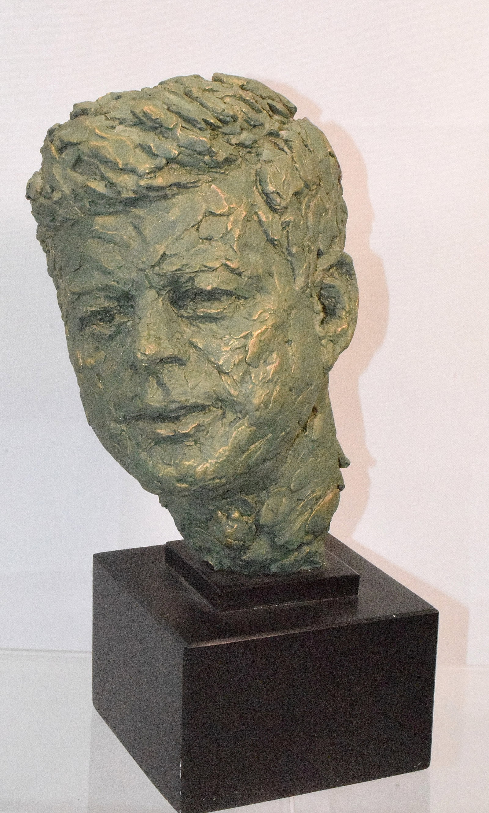 JOHN F KENNEDY BUST replica by ROBERT BERKS: Ca 20th century. Artist Robert Berks. Signed Berks. Clay with a verdigris patina. 13 1/2 inches tall. Good condition