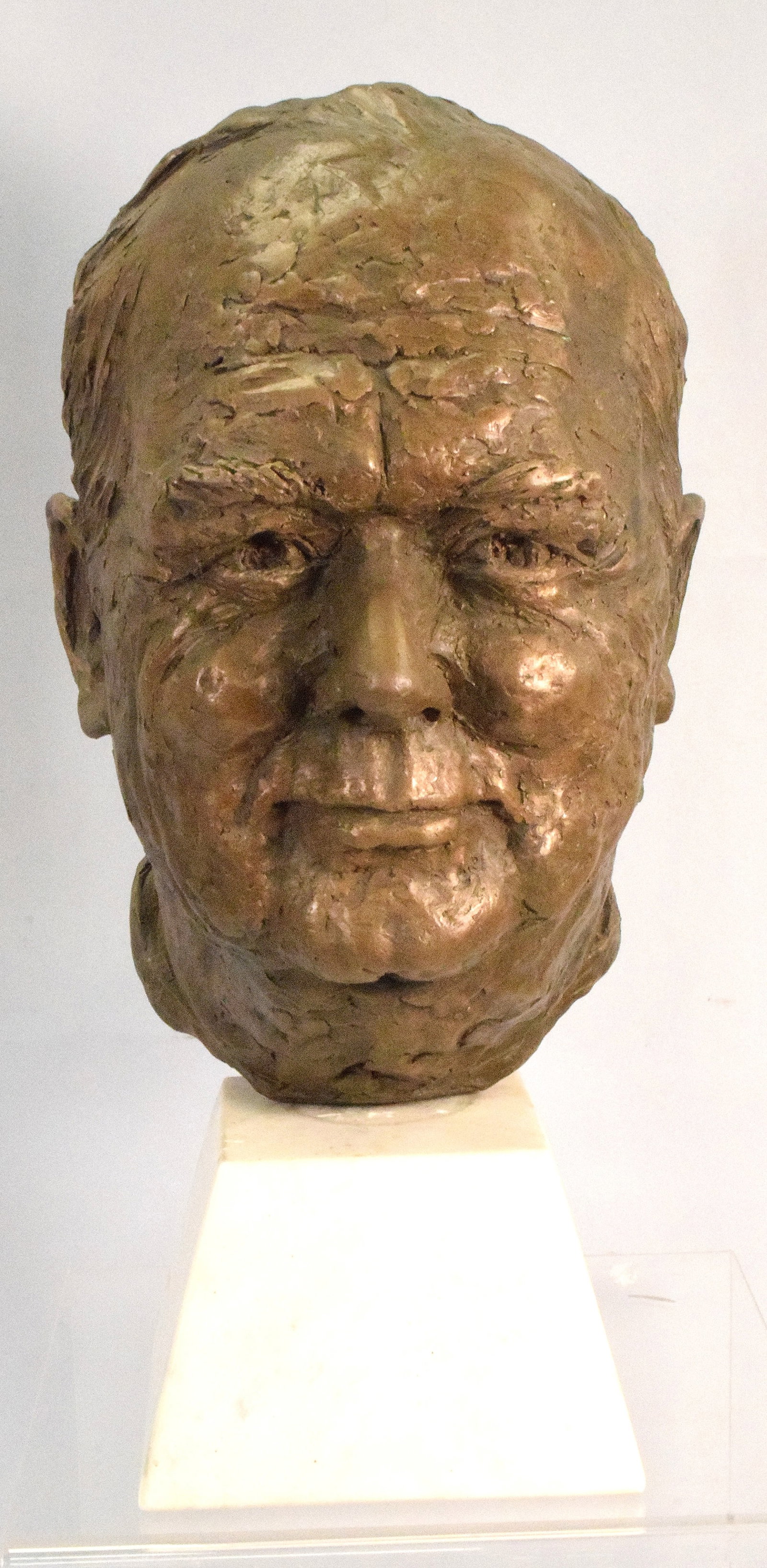 PATINA CLAY BUST OF WINSTON CHURCHILL: Artist signed M. Cattert?. Alabaster base Bronzed patina clay bust of Winston Churchill. 17 inches tall. Ca 1950's. Good condition. The Estate of Nichols Mitropoulos 1952-2025.