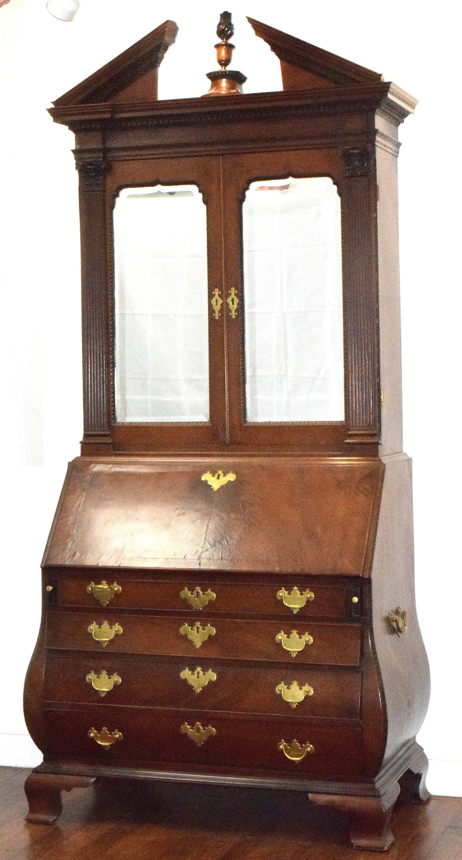 1765-80 BOSTON BOMBE SECRETARY DESK: 18th century Boston secretary desk. With top Bookcase unit broken pediment and finial. 102 inches tall (to top of cornice pediment) x 46 inches wide x 26 inches deep. Fitted originalinterior of desk R