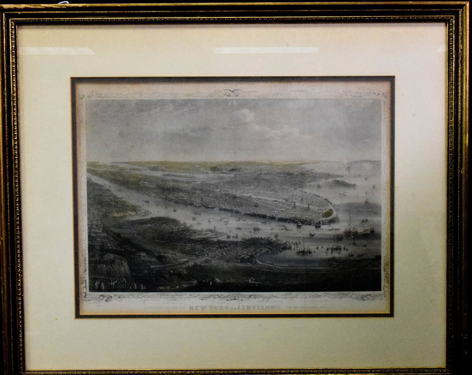 NEW YORK & ENVIRON ENGRAVING: American. On paper. Reading "Designed and Engraved for New York and Environs, The New York Manual 1869" below an image of a vast expanse of New York land masses and waterways, with geographic labels a