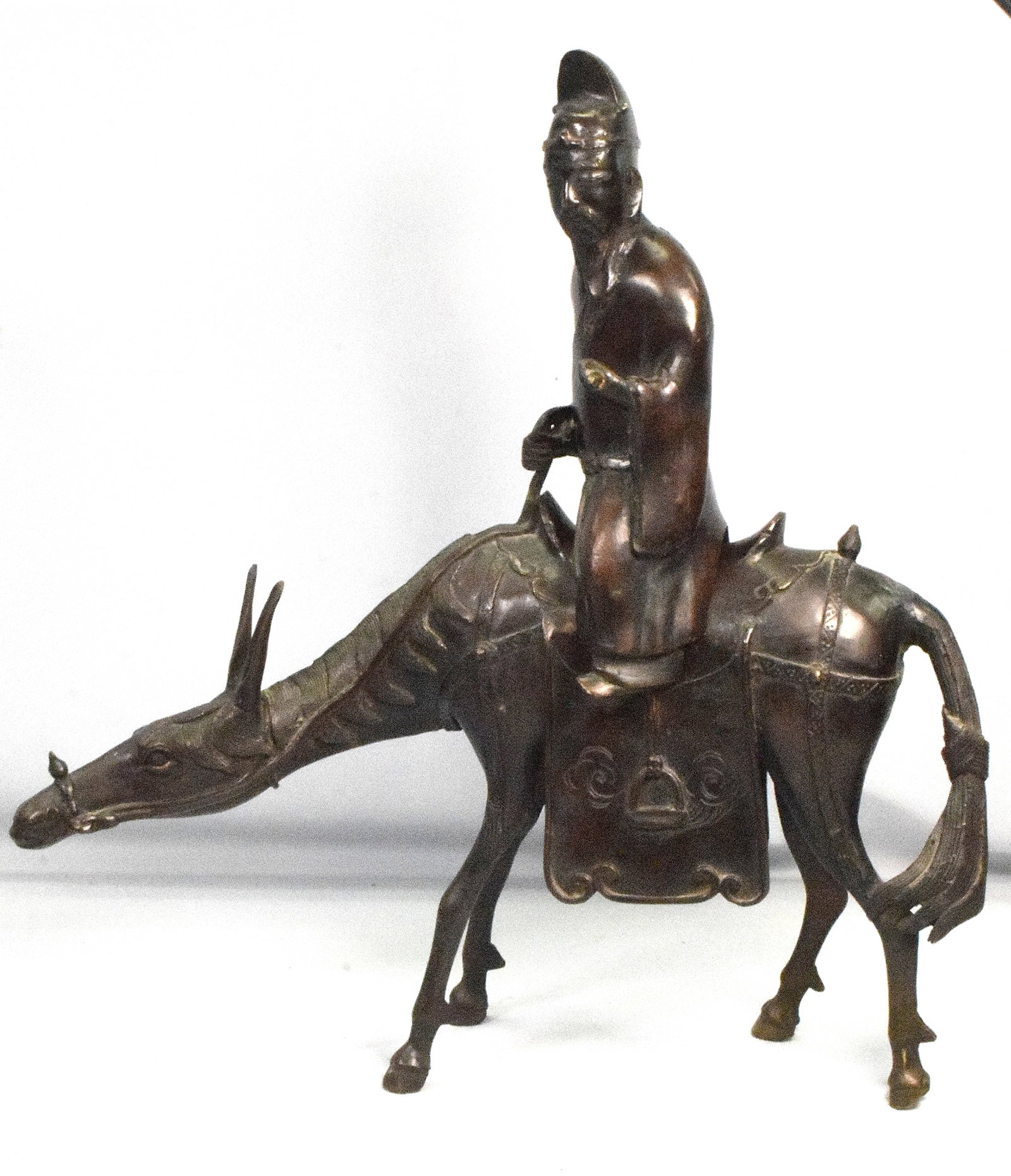 CHINESE BRONZE OF MAN ON HORSE: Chinese Bronze Sculpture of an Immortal on Horseback. The Chinese bronze sculpture of an immortal on horseback. Ca 19/20th. Extra-long ears on horse. No signature or markings. Goodcondition. Oignial p