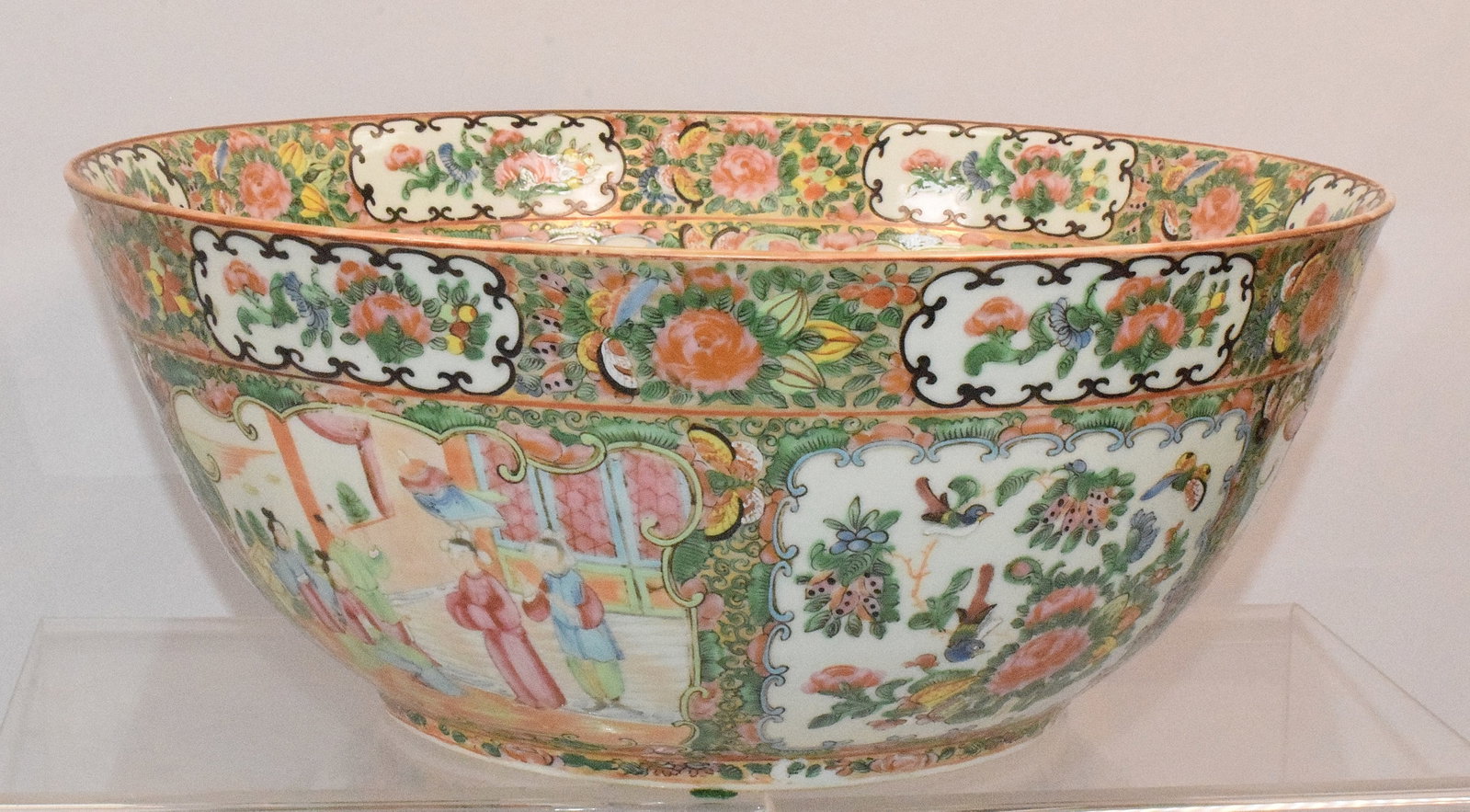 19TH CHINESE ROSE MEDALLION PUNCH BOWL: Ca 19th. Porcelain. Rose Medallion Chinese porcelain punch bowl with figural and floral divided panels.Mid 19th which we believe is Quig Dynasty. 14 1/2 inches diameter x 6 inches tall.Good condition.