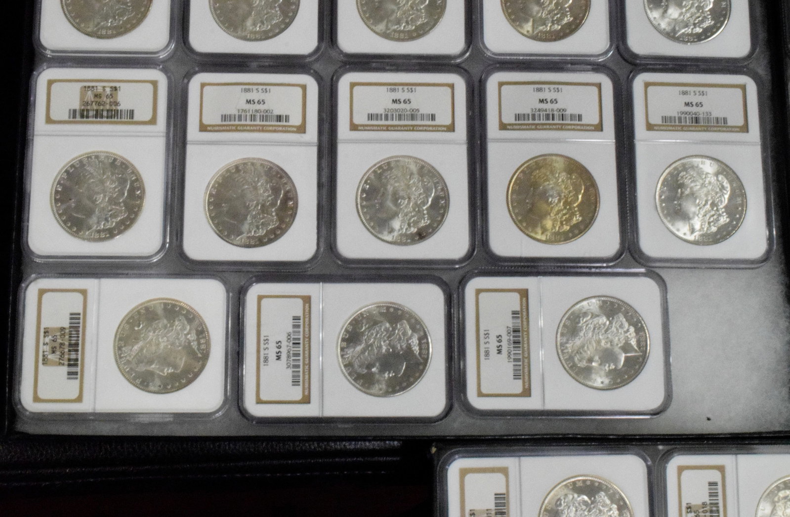 56 GRADED US SILVER MORGAN DOLLARS 1881s - 12