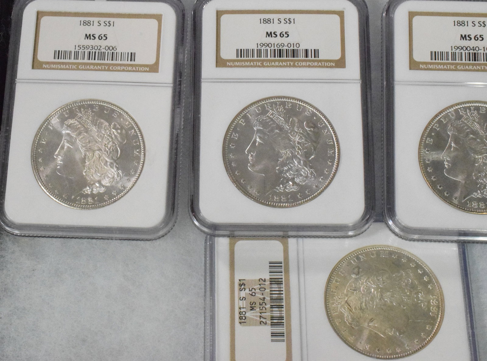 56 GRADED US SILVER MORGAN DOLLARS 1881s - 17