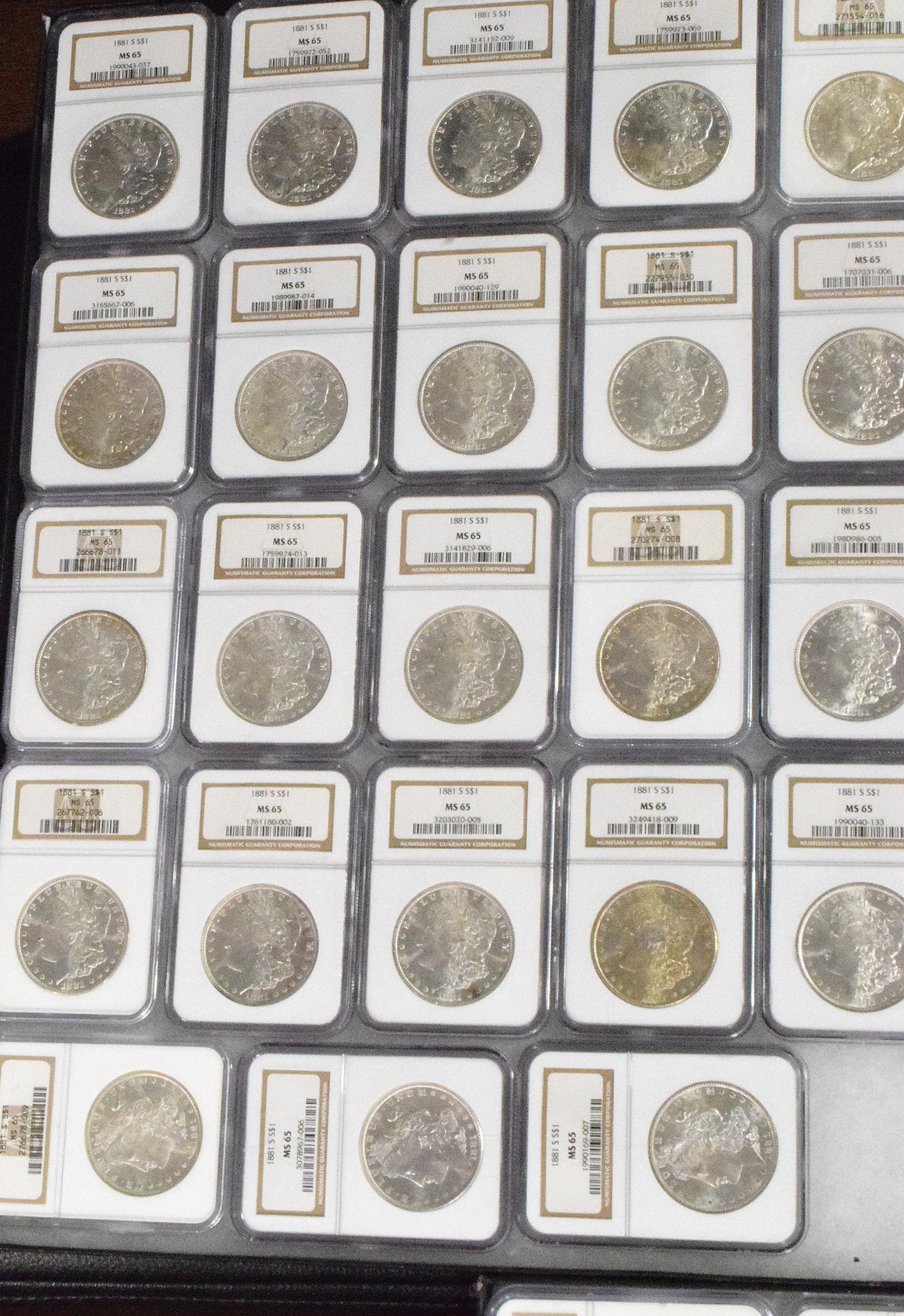 56 GRADED US SILVER MORGAN DOLLARS 1881s - 2