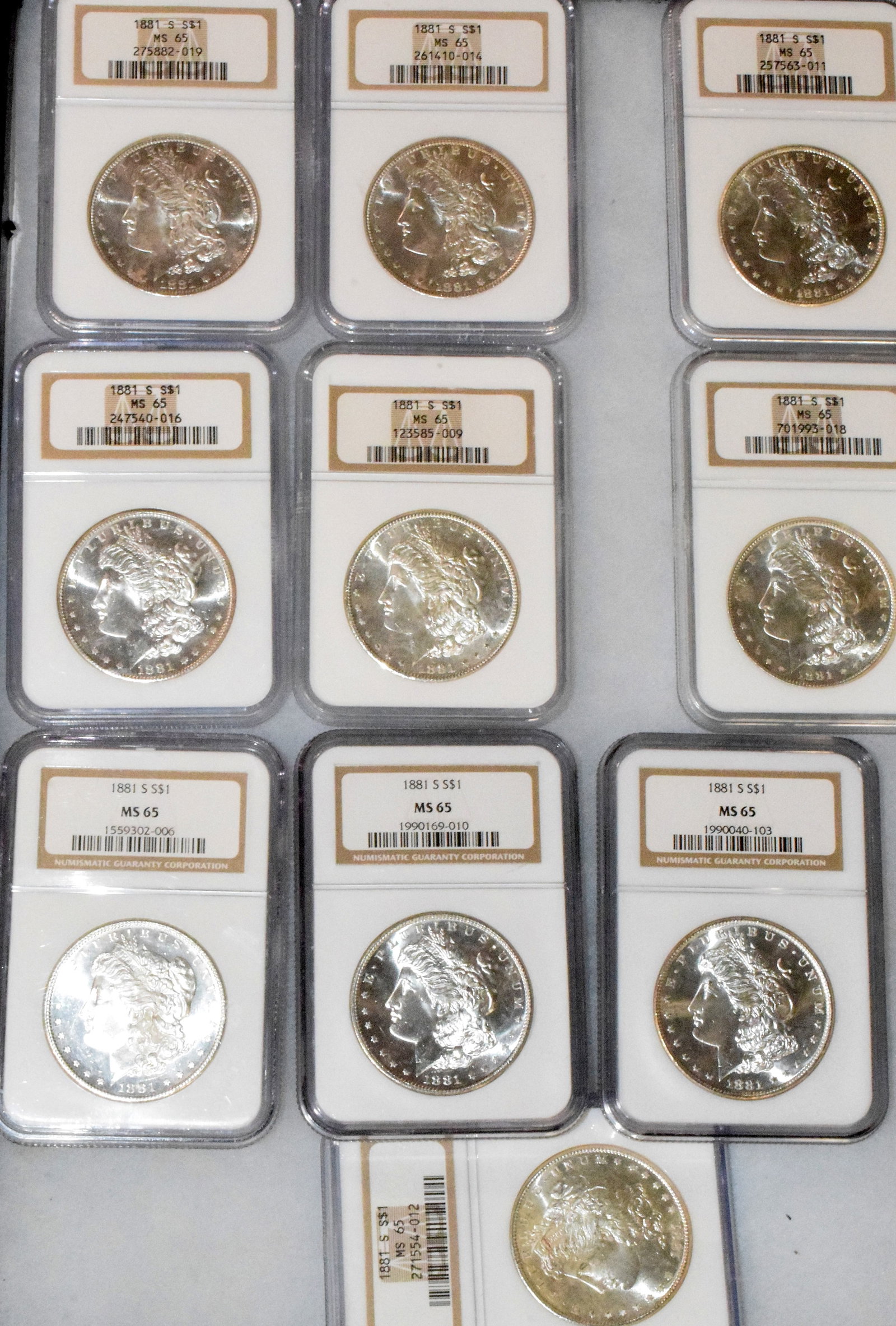 56 GRADED US SILVER MORGAN DOLLARS 1881s - 7