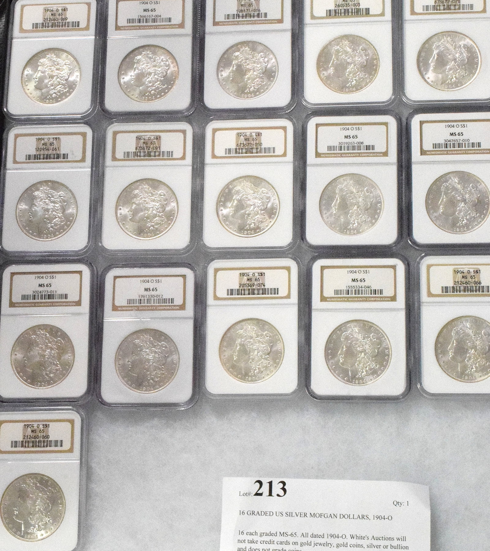 16 GRADED US SILVER MOFGAN DOLLARS, 1904-O: 16 each graded MS-65. All dated 1904-O. White's Auctions will not take credit cards on gold jewelry, gold coins, silver or bullion and does not grade coins