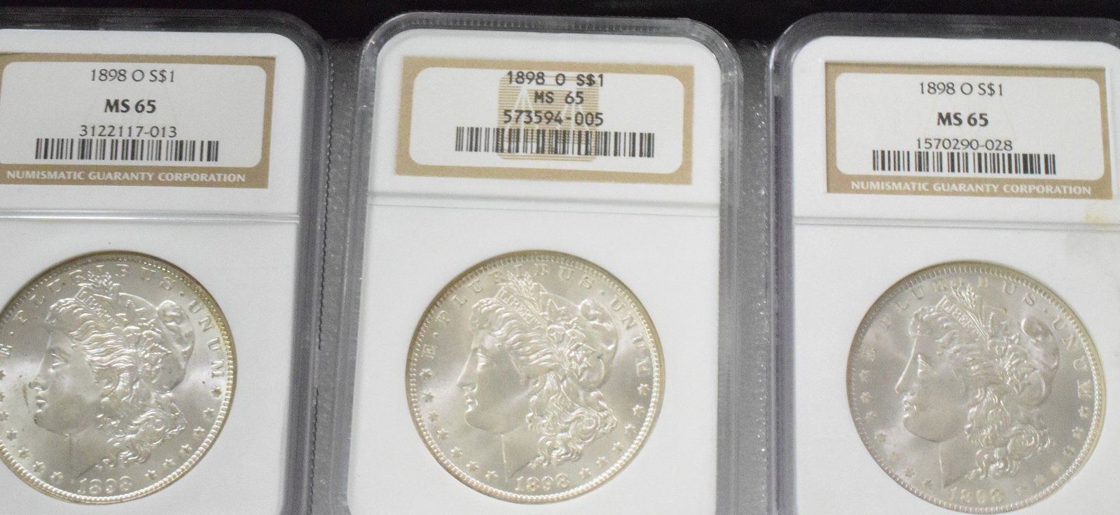 7 GRADED US MORGAN SILVER DOLLARS, VARIOUS DATES - 4
