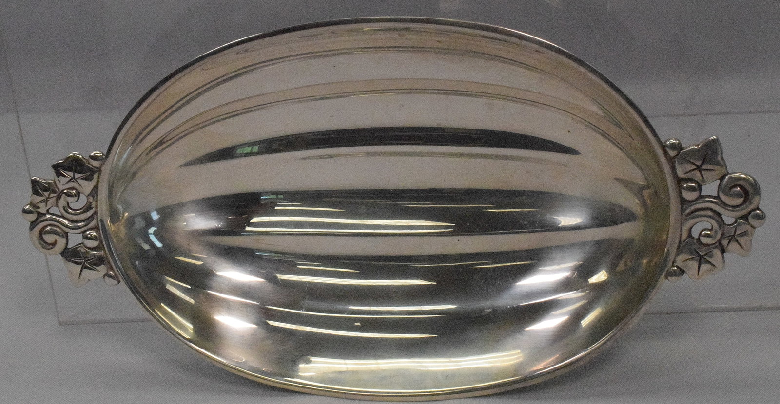 TIFFANY & CO STERLING MELON FORM BOWL: A Tiffany and Company Sterling silver melon form two handles footed bowl. New York 1943. Marked "Tiffany & Co. Makers, Sterling, 22974, M (Star). Approx. 8.94 troy ounces. 10 inches long x 5