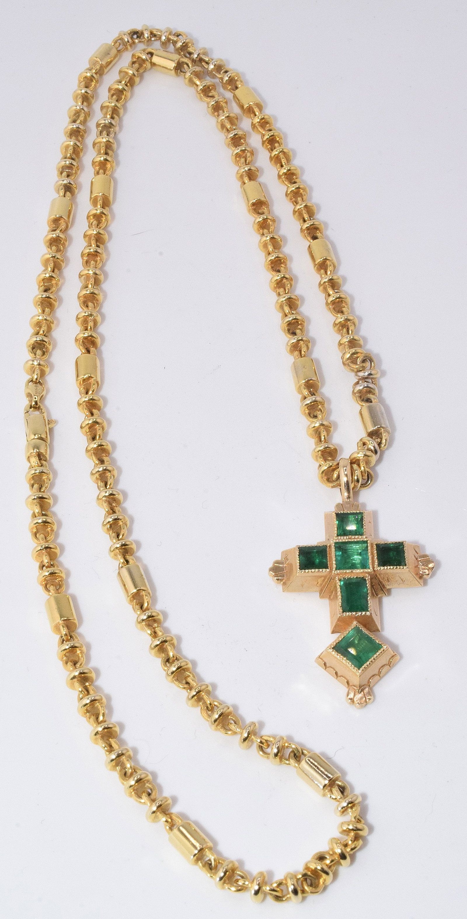 14K EMERALD CROSS & 14K GOLD NECKLACE: A recreation 14k yellow gold emerald cross with a portion of gold from Nuestra Se?ora de Atocha treasure and 14k gold. Cross approx. 1 1/2 inches x 7/8 inch. Emeralds princess cut. Emeralds fromboth C