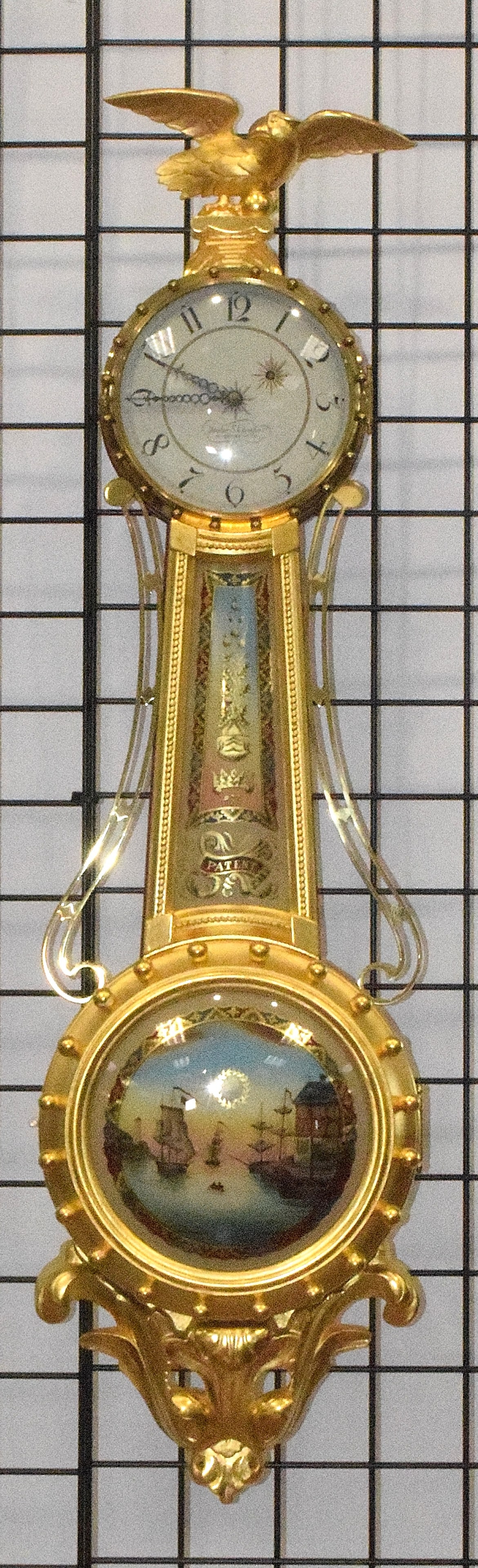 FOSTER CAMPOS GIRANDOLE BANJO CLOCK: Foster Campos Girandole gilt banjo clock. This is the first clock made that year (1995) and has never been used. Case marked inside number 1 and number 95. Painted 7 1/2 inches dial signed Foster S. C