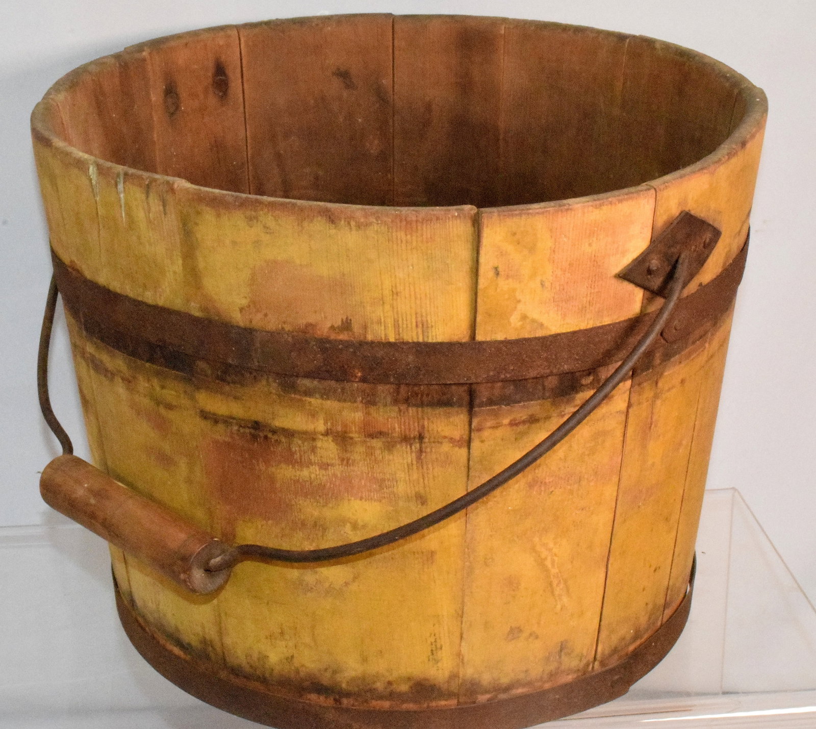 WOODEN STAVE BUCKET: Bucket has faded markings on bottom, believed to spell out "Dinnir CB" and a carved marking that spells out "JR". Metal handle with wooden revolving bailed handle grip. Good condition. 91/4" x 12" x