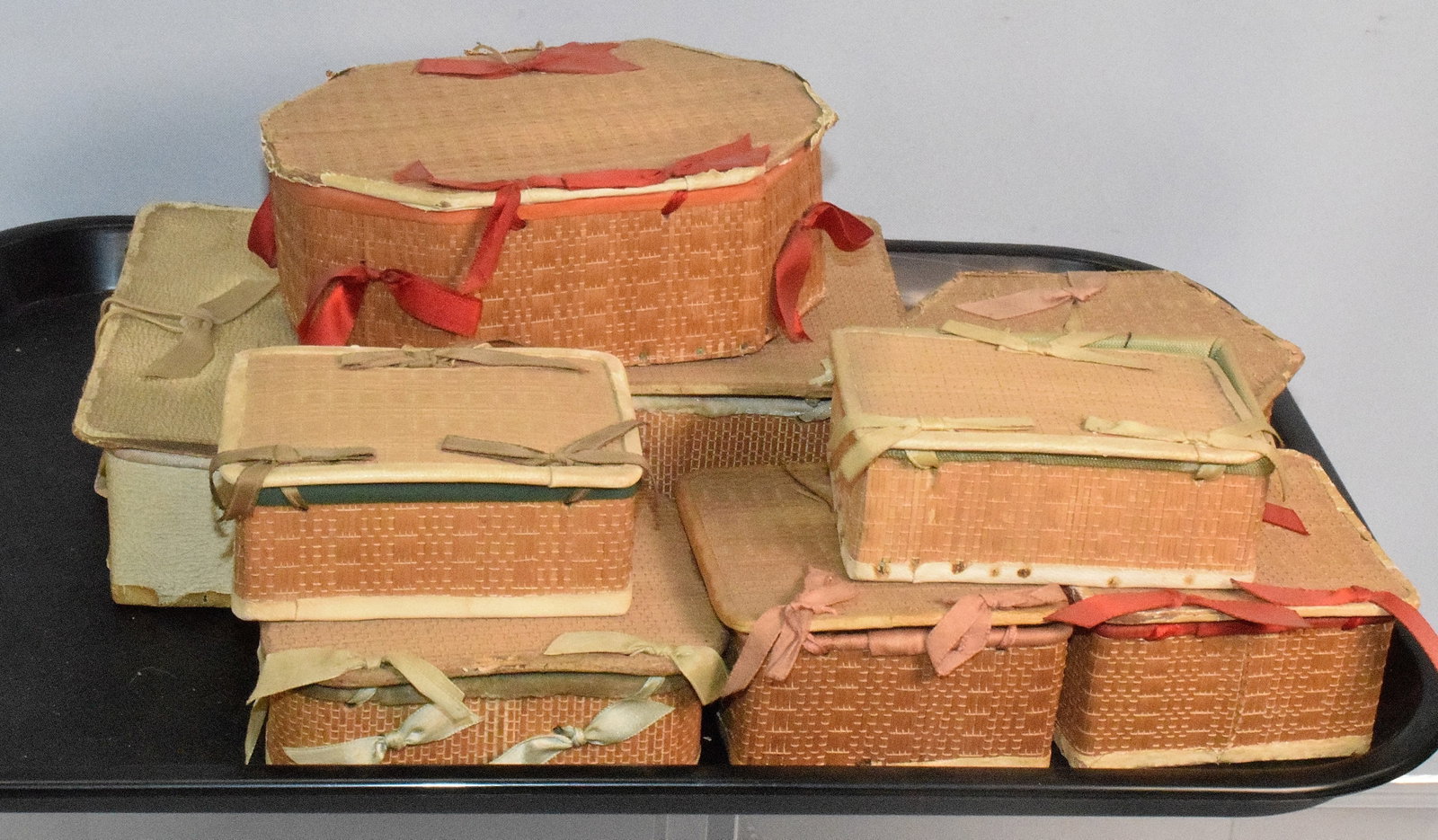 9 SHAKER POPLARWARE SEWING BOXES & OTHER ITEMS: 6 are Marked Shaker Goods, Alfred, Maine. 3 are not marked. Some have pincushions and needle cases. Most have some wear, fading and are not clean. Estate condition. Poplarware refers to handmade "fanc