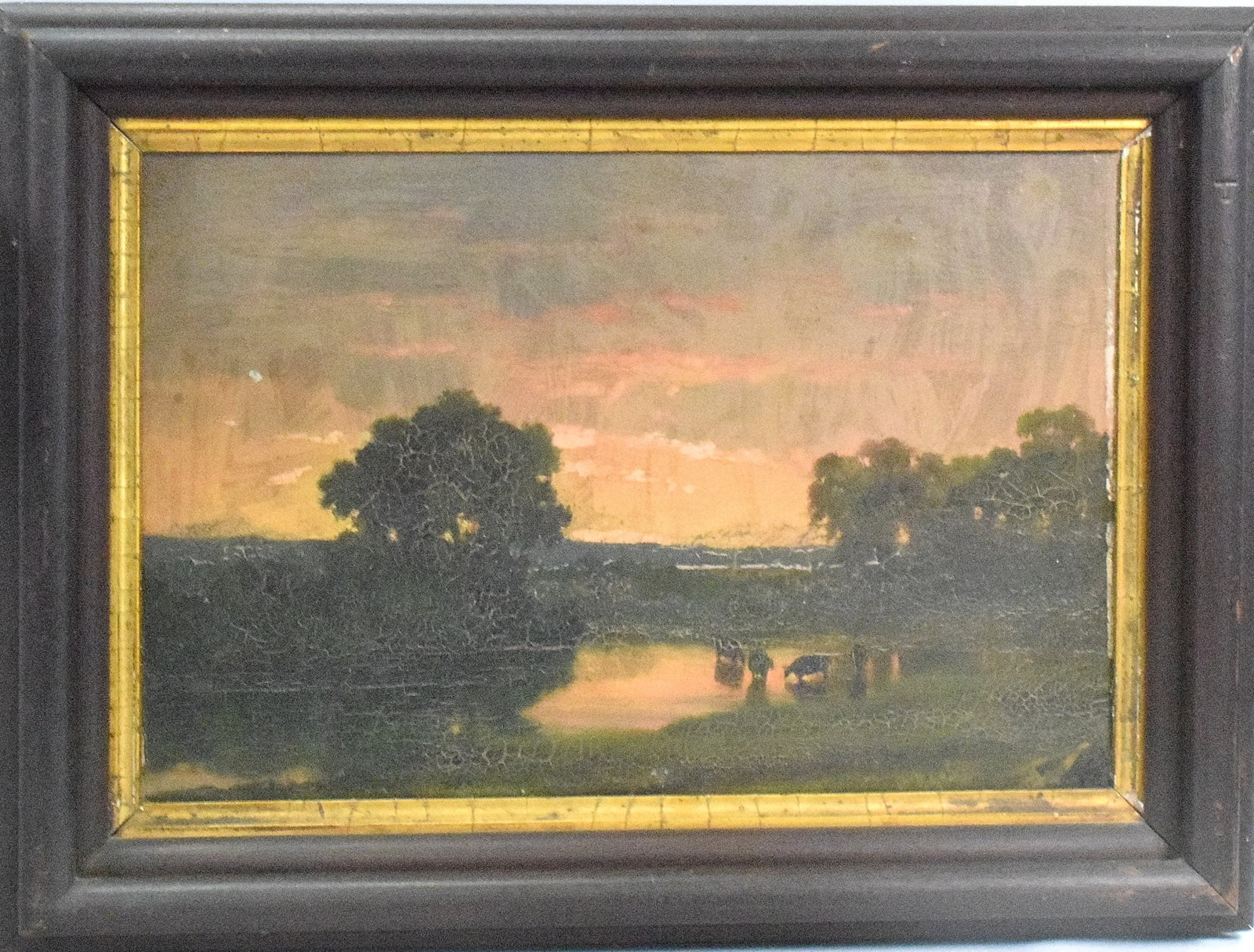 19TH AMERICAN PASTORAL OIL PAINTING: 19th pastoral oil paint that depicts cows in water with luninist subset landscape. Oil on board. Image 9 inches x 13 inches. Don't known it marked in lower right. Craquelure and other finishissues. As