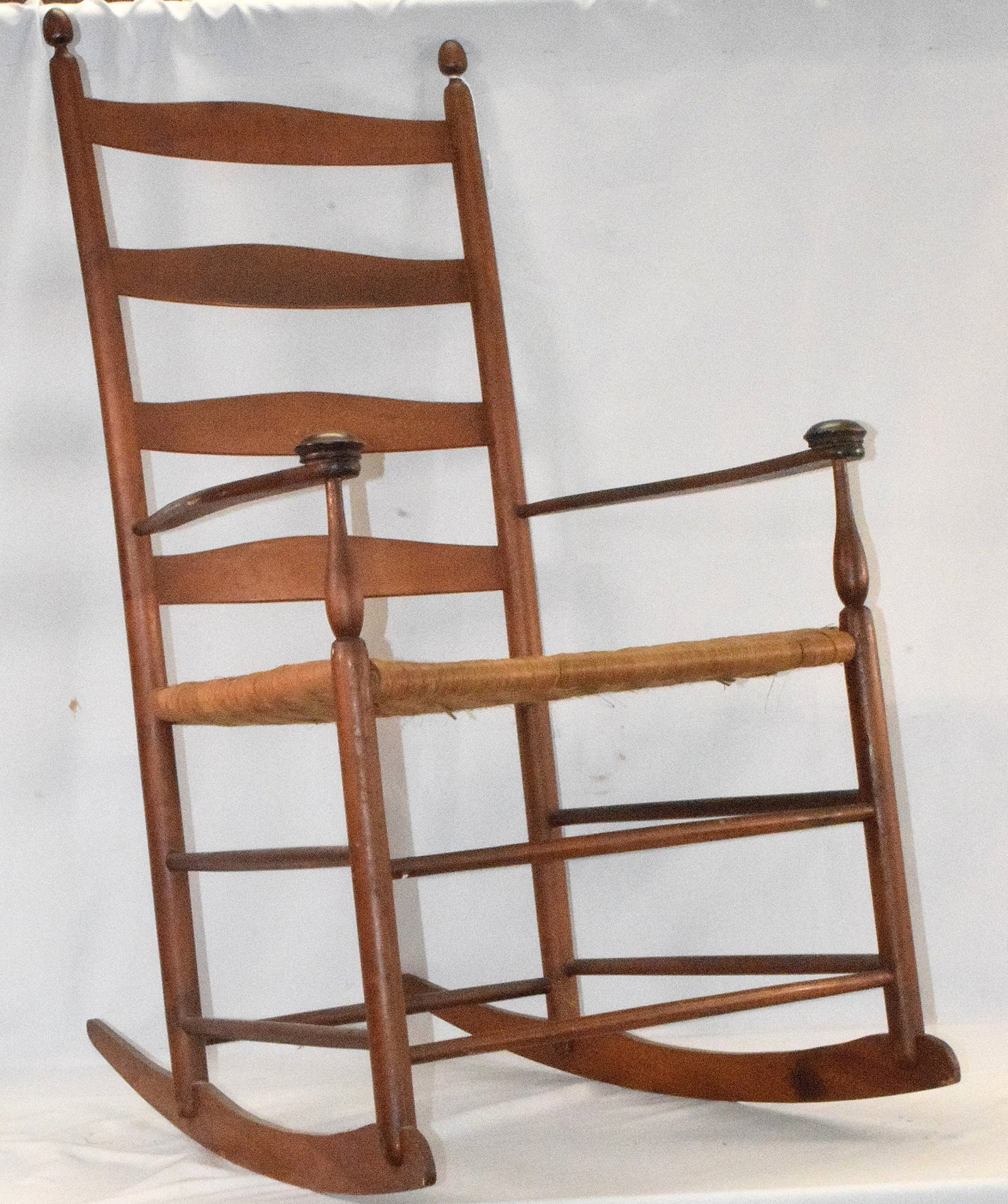 SHAKER ROCKING CHAIR: Shaker rocking chair, good condition, rattan seat and mushroom capped arms, measures 42 1/2 " x 23 1/2 ", .
