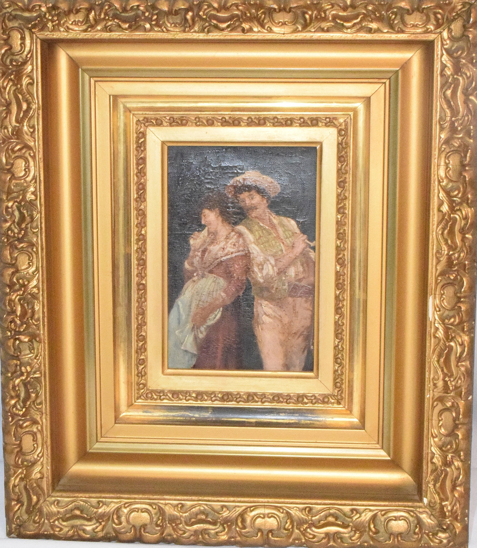 19TH CENTURY ITALIAN OIL ON CANVAS PAINTING: Unsigned. Features a scene with a man and a women standing shoulder to shoulder with the woman looking off to the left and the man standing to her left holding a pipe. Has craquelure on thesurface of 