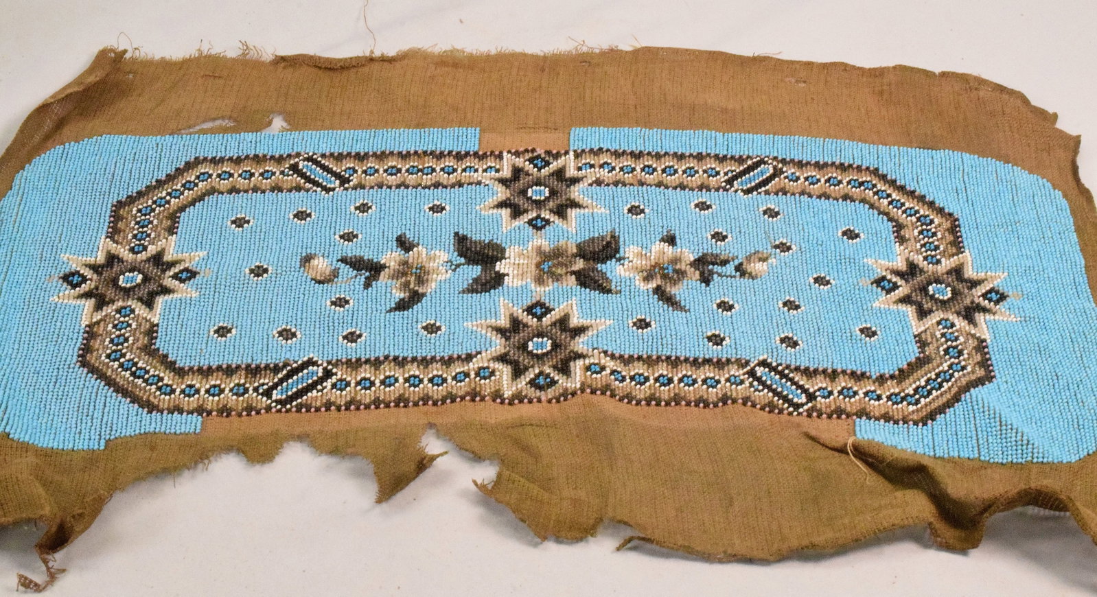 PART NATIVE AMERICAN STYLE BEADED BAG CLOTH: Believe start and not finish beaded bag. Floral and geometric designs. As is. 21 inches long x 13 1/2 inches wide. Ca 19th century.