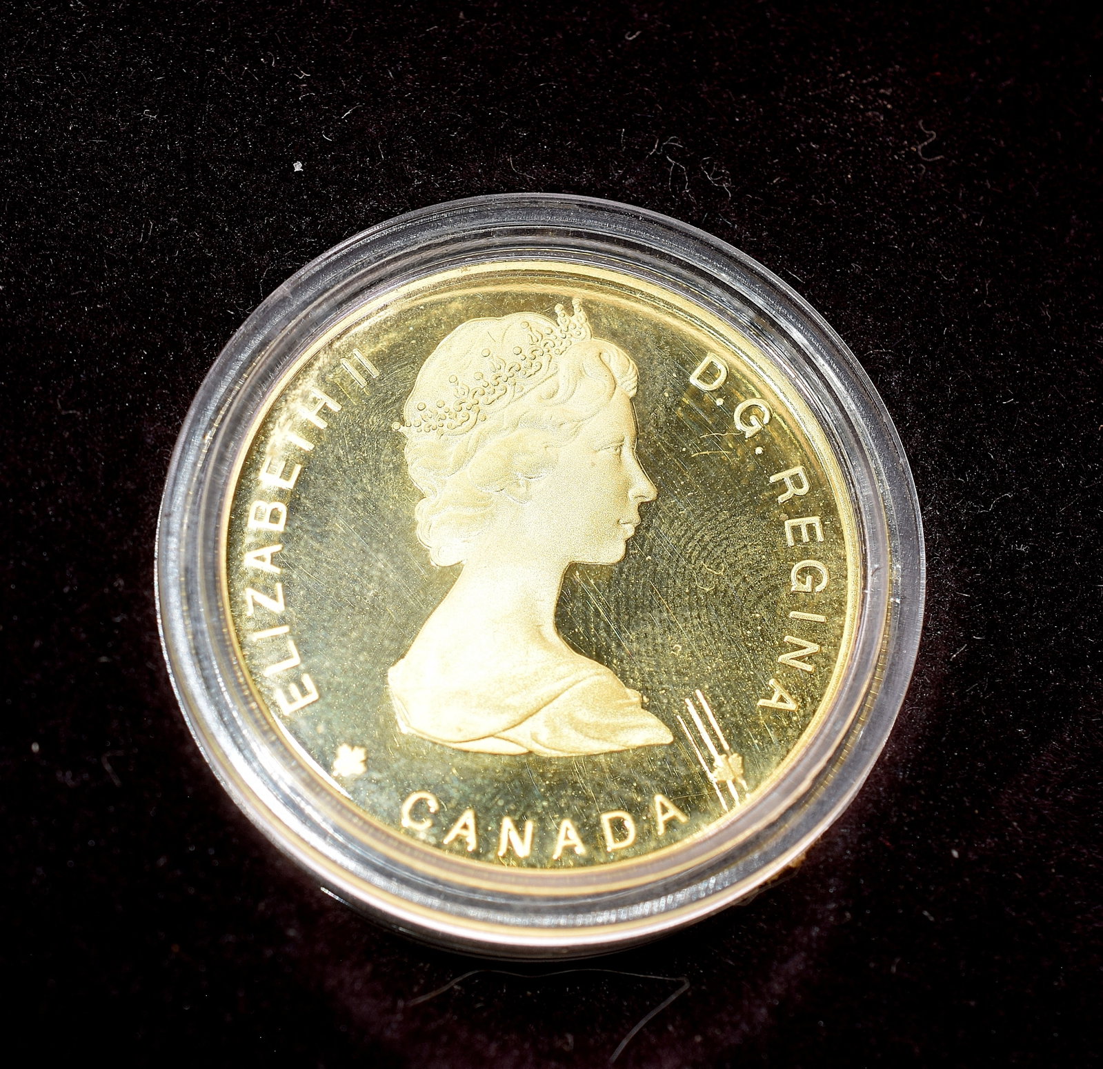 1984 CANADA $100 GOLD COIN: 1984 Canada $100 gold coin, good condition, comes in original brown box with good conditioned. Paper describing the significance of the gold coin itself, box measures 5 1/2 " x 4 1/2 ".