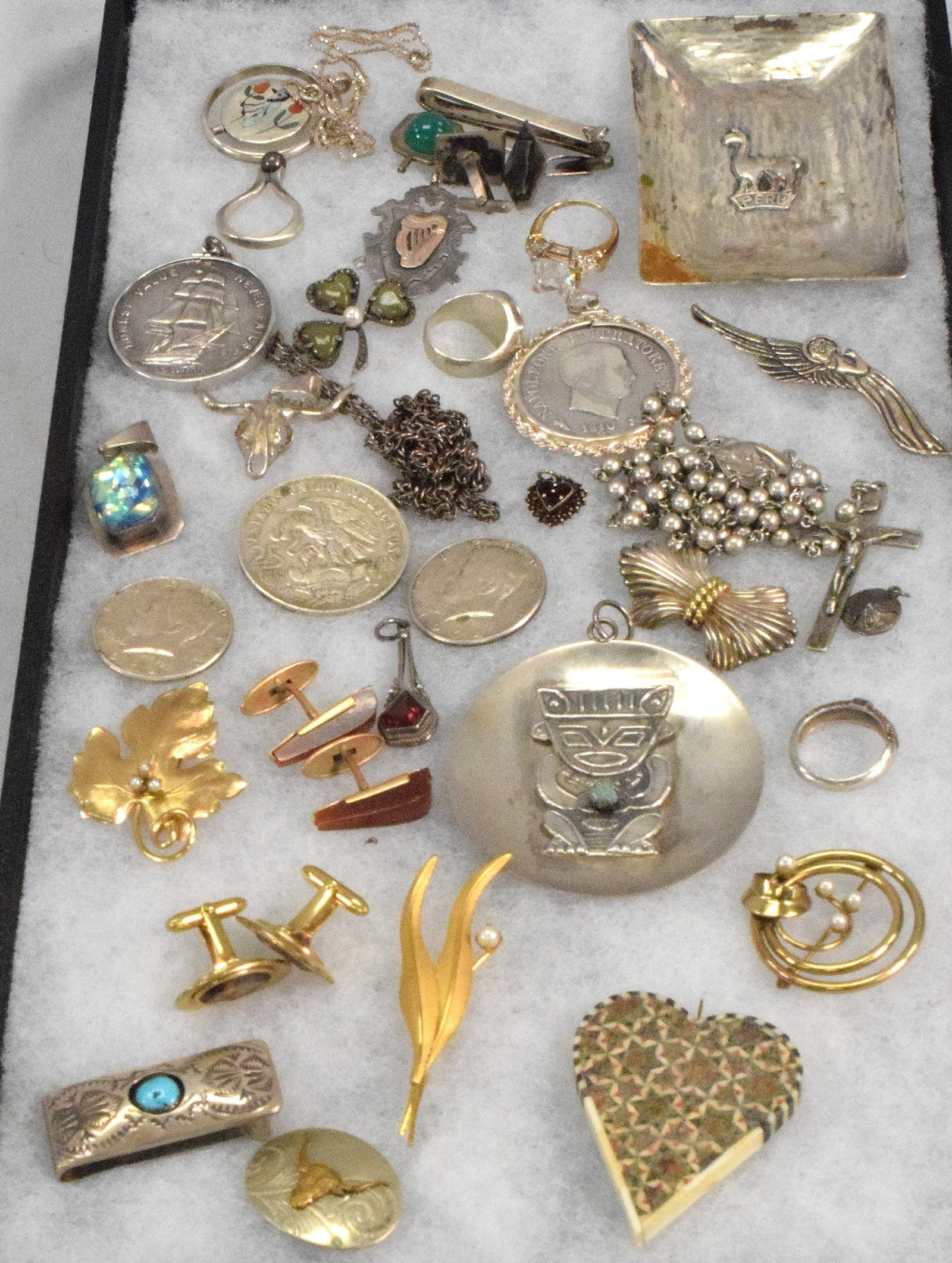 ASSORTED SILVER & OTHER JEWELRY: Consists of 22 silver pieces that weight is approx. 10.19 troy ounces. Consists of Peru dish, Peru pendant, 2 1964 Kennedy 1/2 dollars, 1972 Olympic metal, 1973 Consitition 1 ounce metal,1801