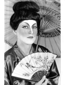 Photo of Japanese Geisha Model Holding Fan and Parasol