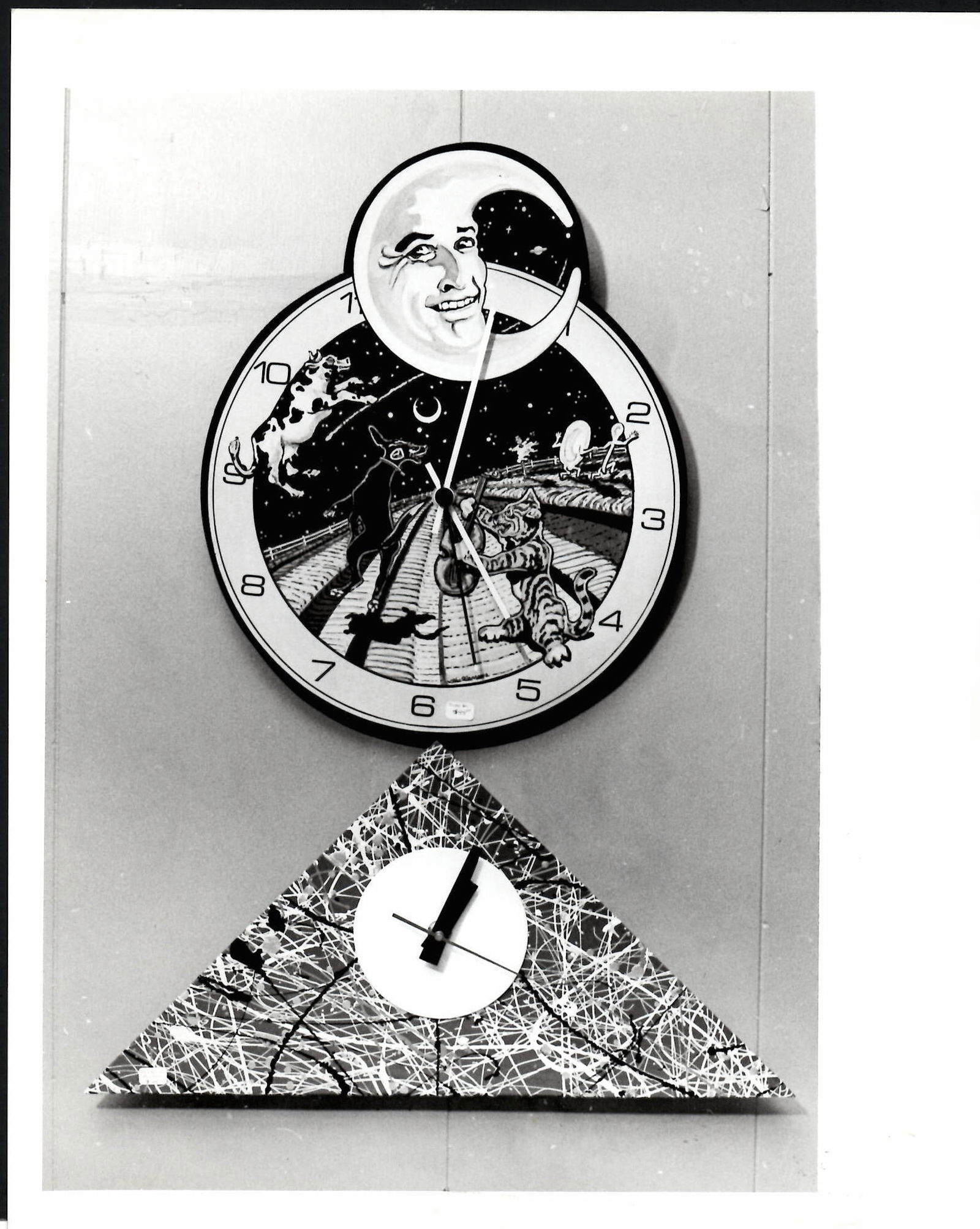 Vintage Photo Pair of Clocks Hey Diddle Diddle & Abstra: Vintage Photo Pair of Clocks Hey Diddle Diddle & Abstract Art Triangle Photo size:10 x 8 inches Provenance: New York-Based Photography Collector & Curator -Collection of Rare Photographs. Photo may ha