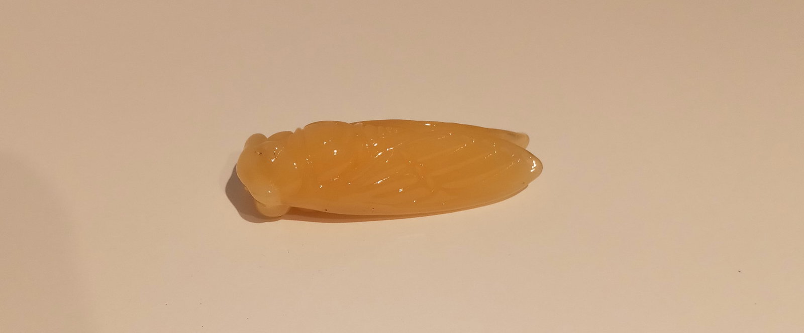 Light Amber Natural Carved Jade Cicada Pendant: Light Amber Natural Carved Jade Cicada Pendant . Approx Size: 60 mm x 21 mm - . Note: Pictures are as accurate as possible, however color may look different on each monitor. . Good Condition. see phot