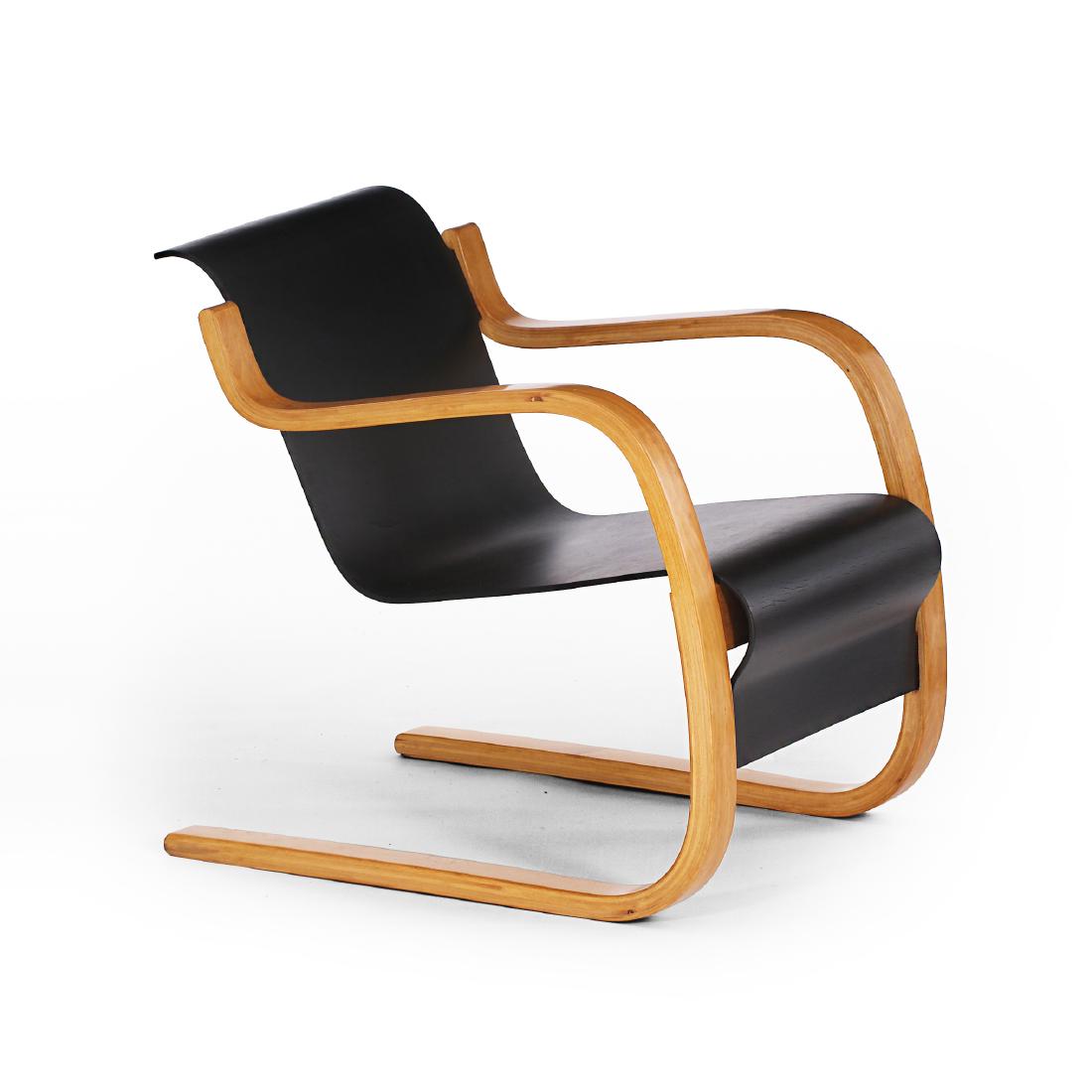 Alvar Aalto: A circa 1950sÂ version of Alvar Aalto's cantilevered plywood chair model 31 / 42. Designed in 1932. Graciously aged example in good original condition.Â Manufactured byÂ Oy Huonekalu-ja Rakennus