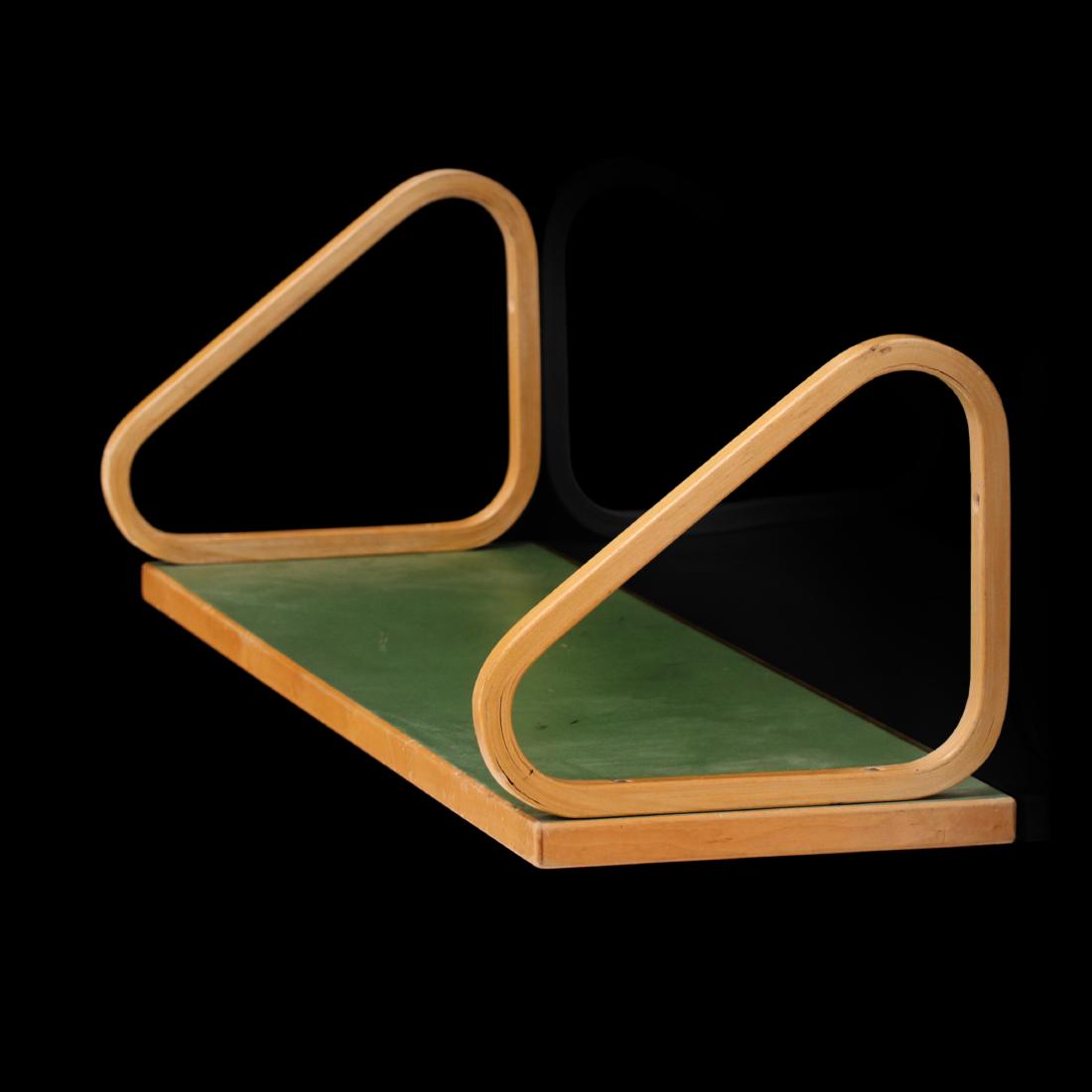 Alvar Aalto: A very rare version of Alvar Aalto's 112b shelf with triangular consoles and bright green linoleum shelf top. Circa early 1950s edition. Examples of shelves with linoleum tops are not common.Â Manuf