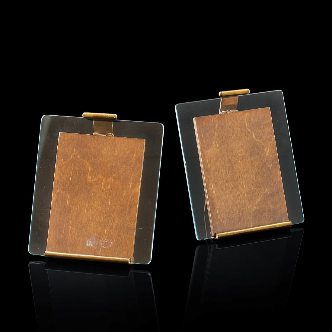 Maija Heikinheimo: Elegant pair of rareÂ picture stands with brass and glass detailsÂ designed by Maija Heikinheimo and manufactured by ValaistustyÃ¶ Ky dating from 1950s.