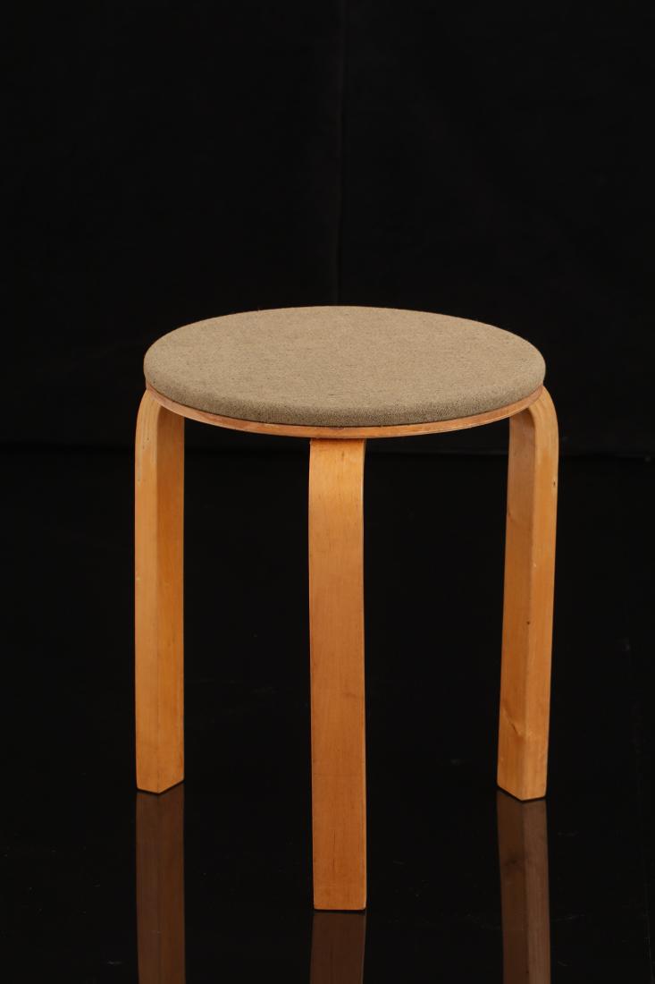 Alvar Aalto: 1930s editon of Alvar Aalto's iconic stool model 60. Upholstered with a design detail on the profile of the seat which was used only for a short while. The seat profile has a cut to which the fabric i