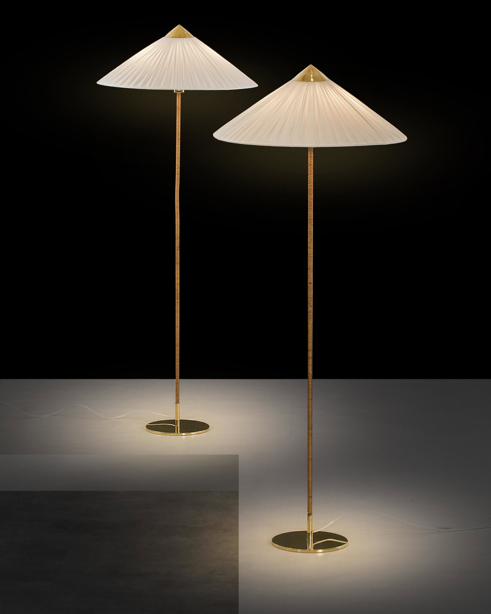 Paavo Tynell: A pair of floor lamps model 9602 designed by Paavo Tynell for Taito Oy., Nice condition, Brass, rattan, silk shades, Height: 143cm, Taito Oy Ab